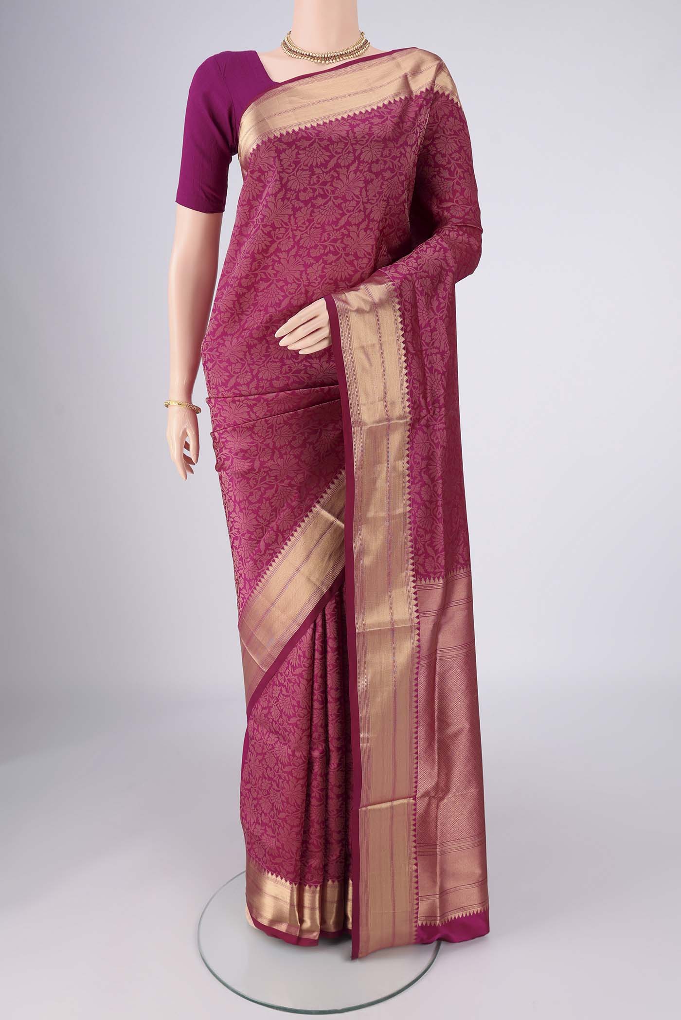 Magenta Soft Silk Saree with Zari Brocade on the body and Zari Border.  displayed on a mannequin