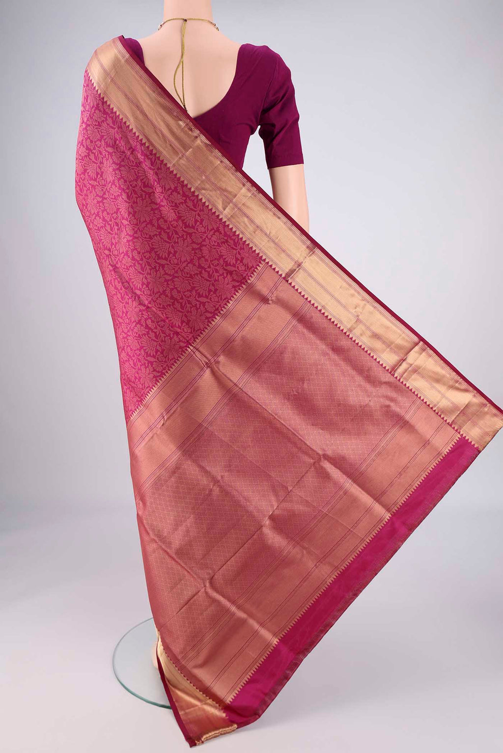 Flat view of Magenta Soft Silk Saree with Zari Brocade on the body and Zari Border. 