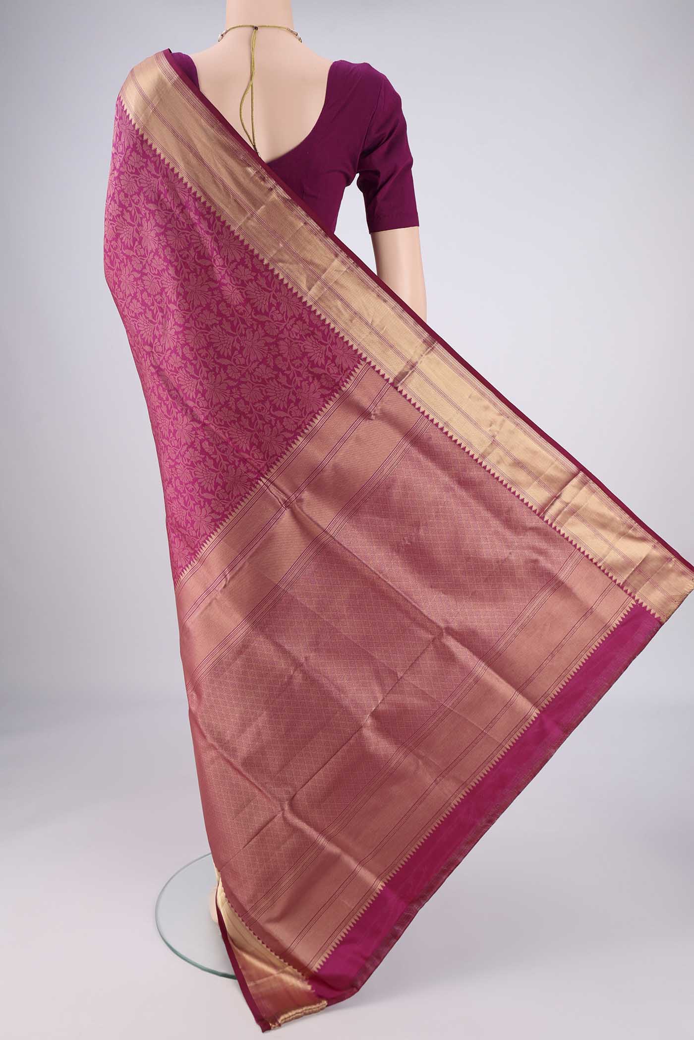 Flat view of Magenta Soft Silk Saree with Zari Brocade on the body and Zari Border. 