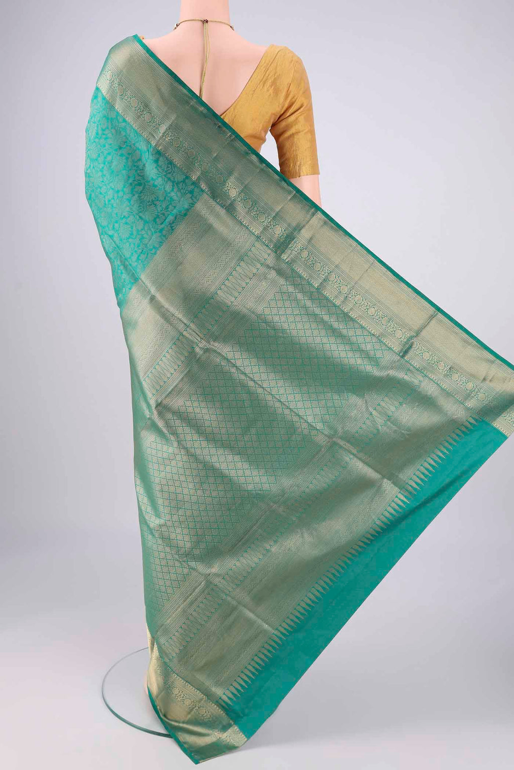 Flat view of Sea Green Soft Silk Saree with Zari Brocade on the body and Zari Border. 