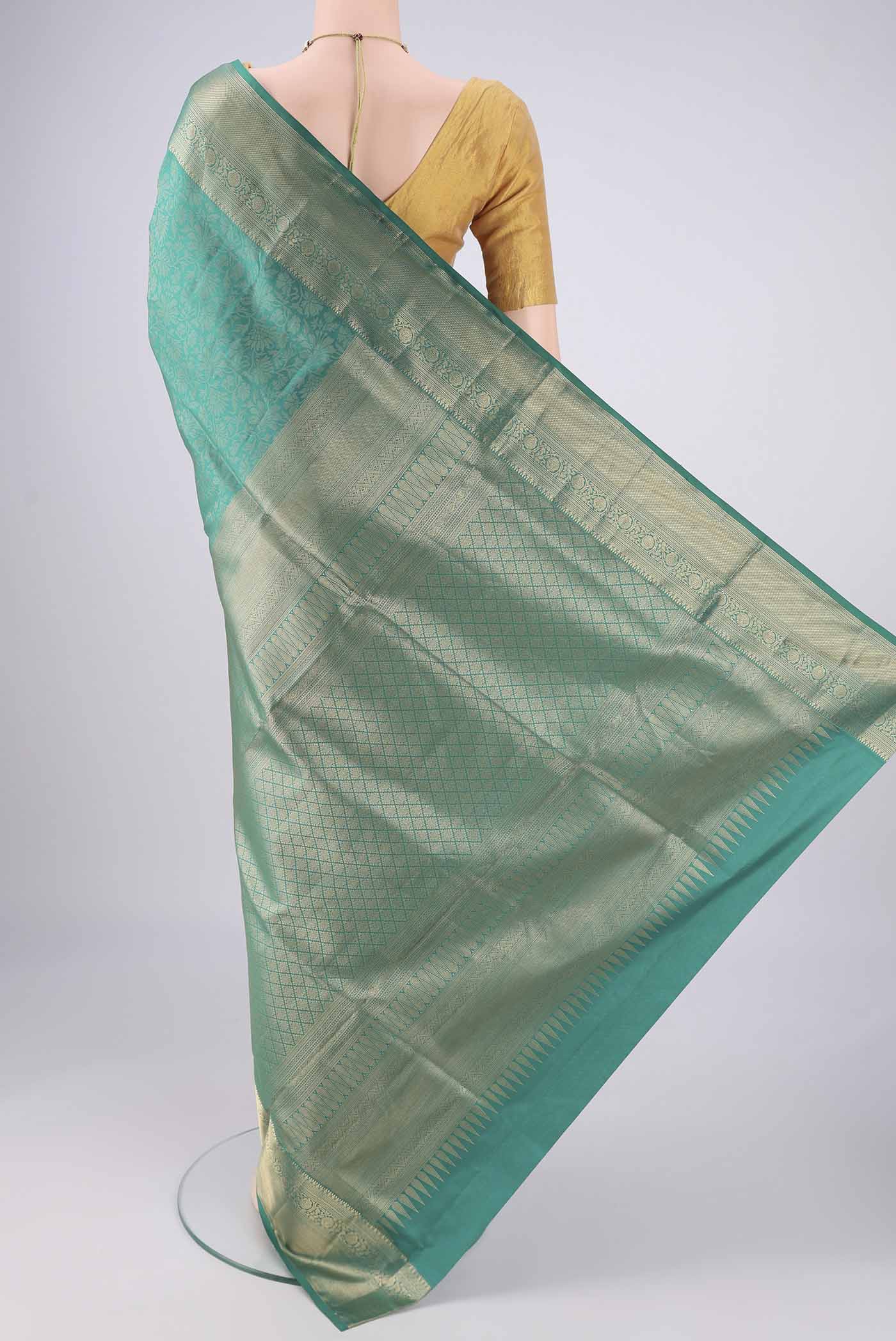Flat view of Sea Green Soft Silk Saree with Zari Brocade on the body and Zari Border. 