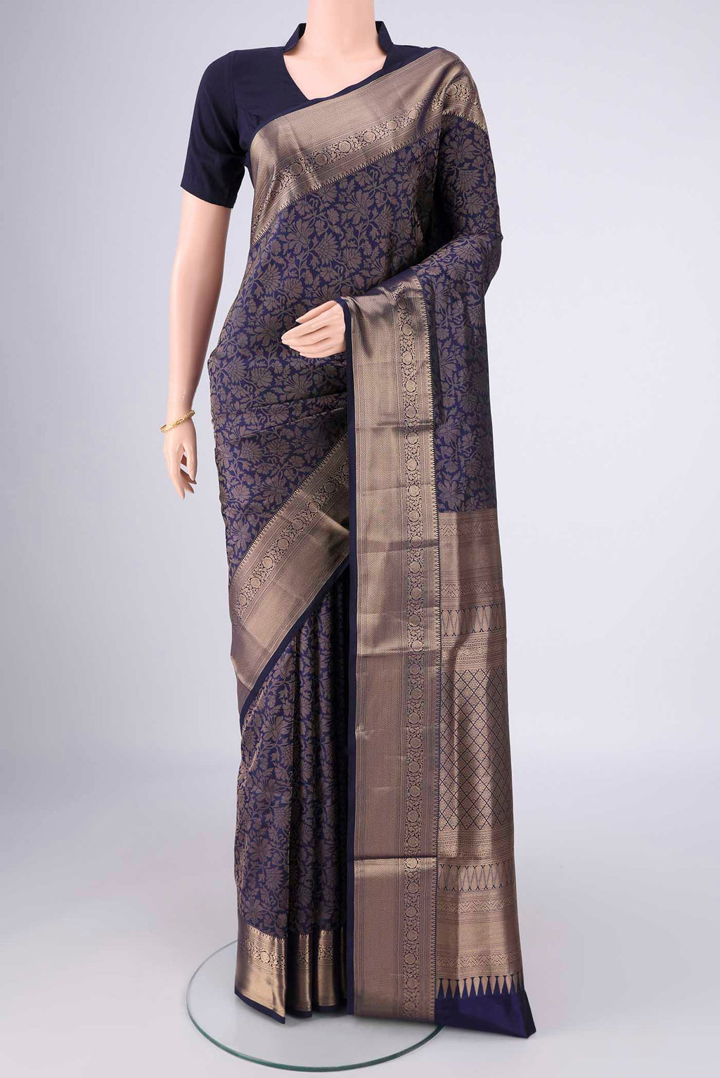 Navy Blue Soft Silk Saree with Zari Brocade on the body and Zari Border.  displayed on a mannequin