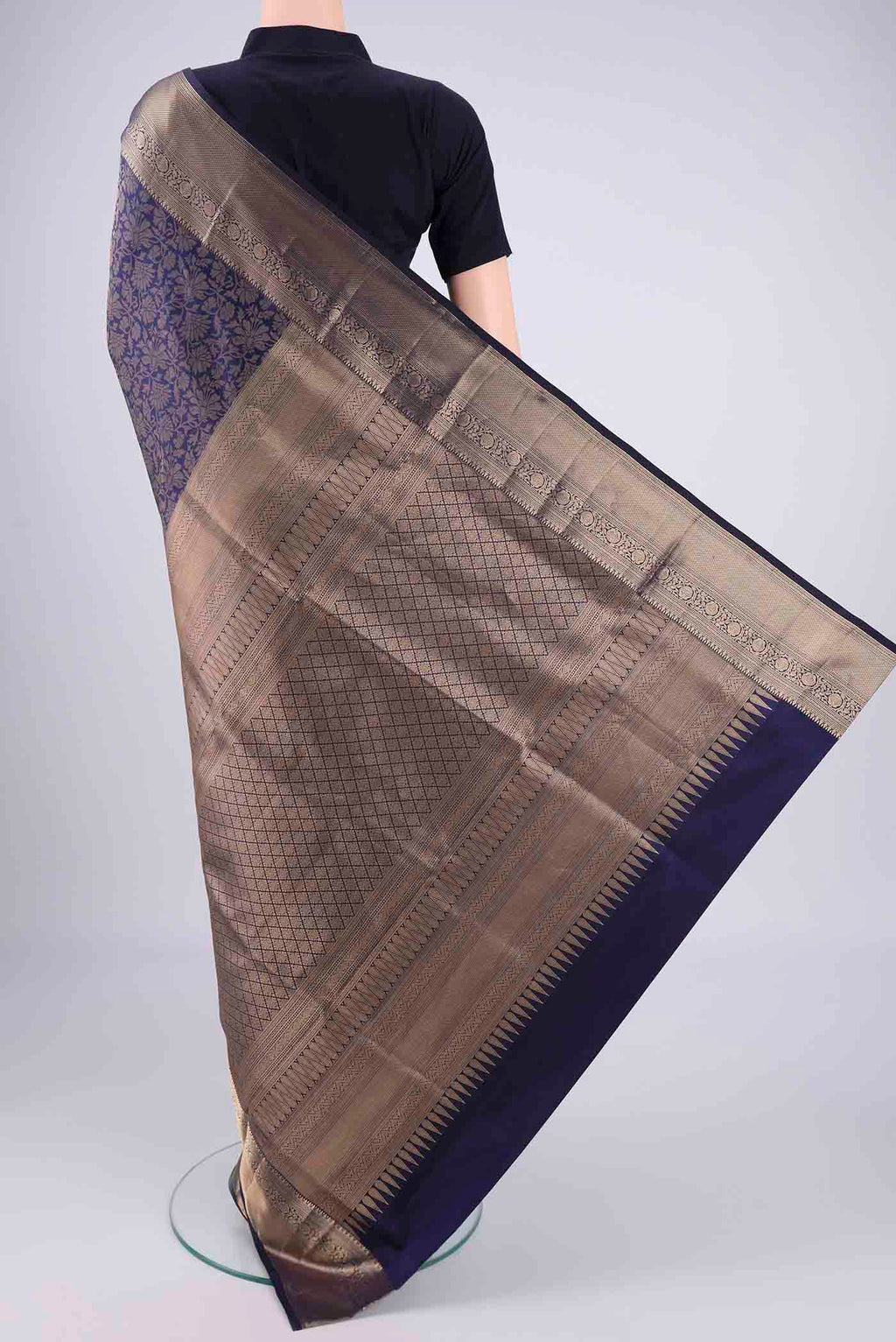 Flat view of Navy Blue Soft Silk Saree with Zari Brocade on the body and Zari Border. 