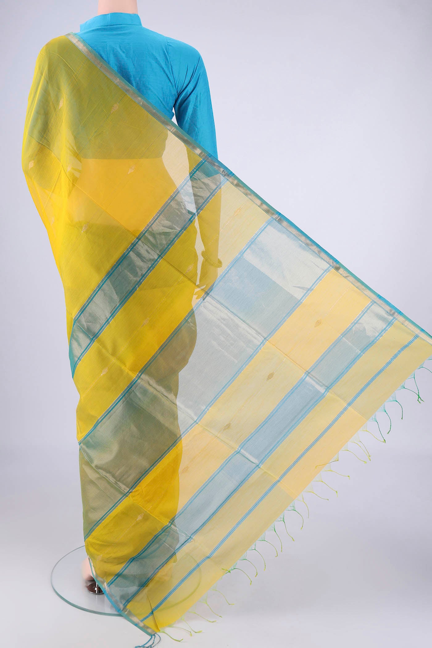 Flat view of Yellow Maheshwari Silk Cotton Saree with Zari Butta on the body and Zari Border. 