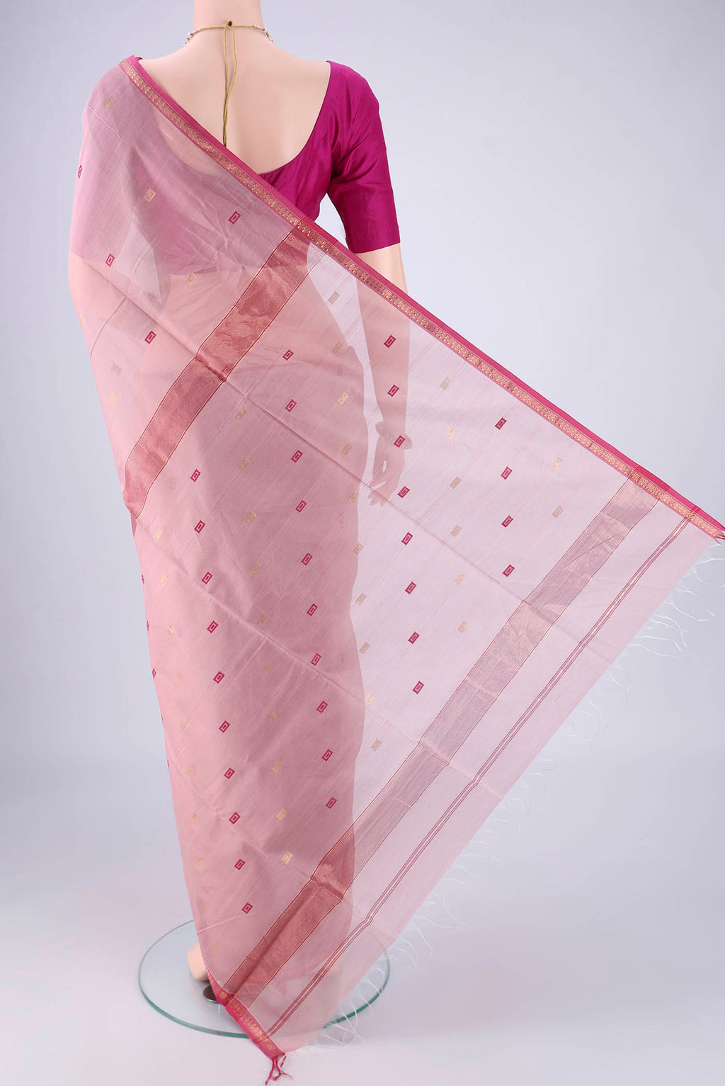 Flat view of Rose pink Maheshwari Silk Cotton Saree with Zari And Thread Butta on the body and Zari Border. 