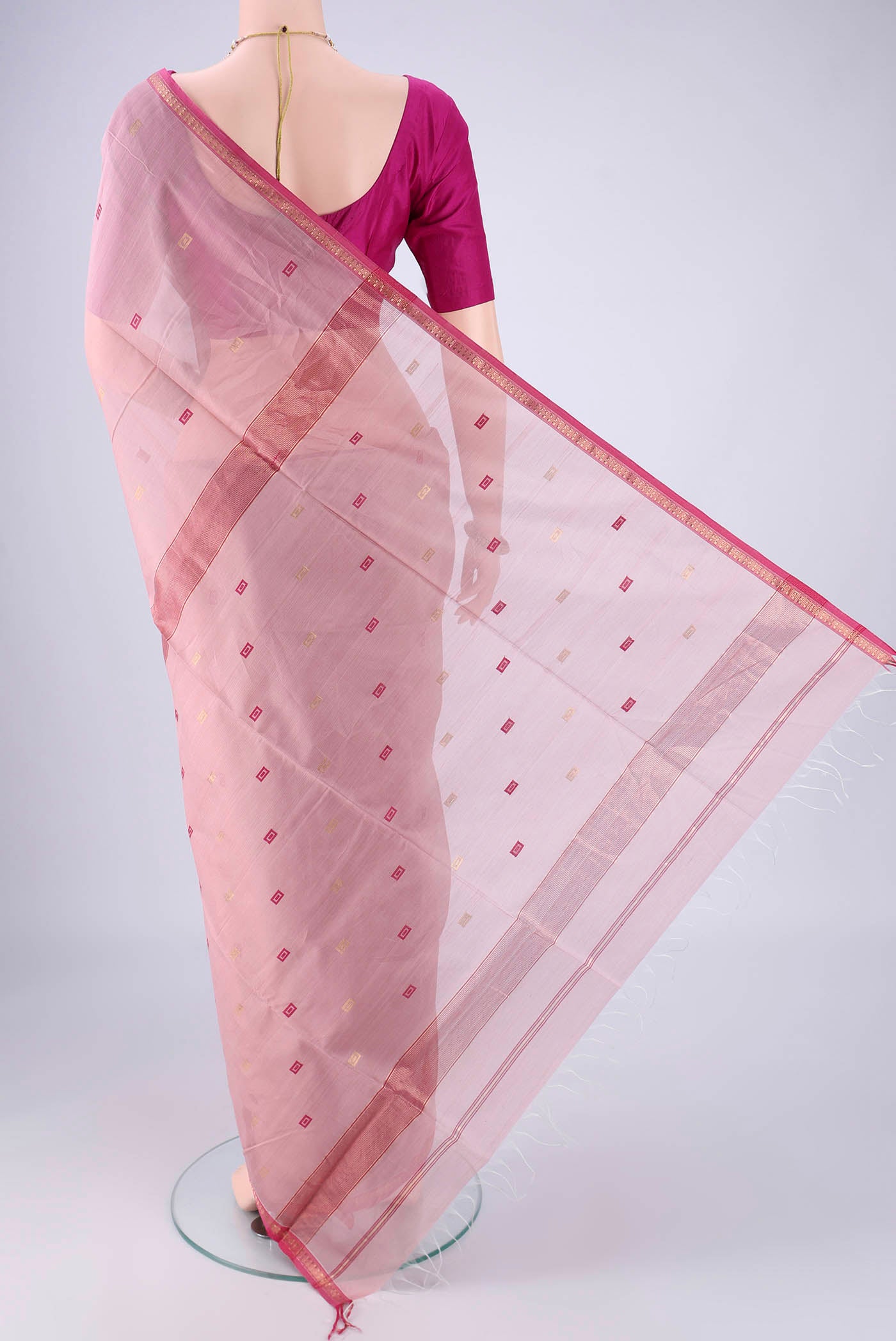 Flat view of Rose pink Maheshwari Silk Cotton Saree with Zari And Thread Butta on the body and Zari Border. 