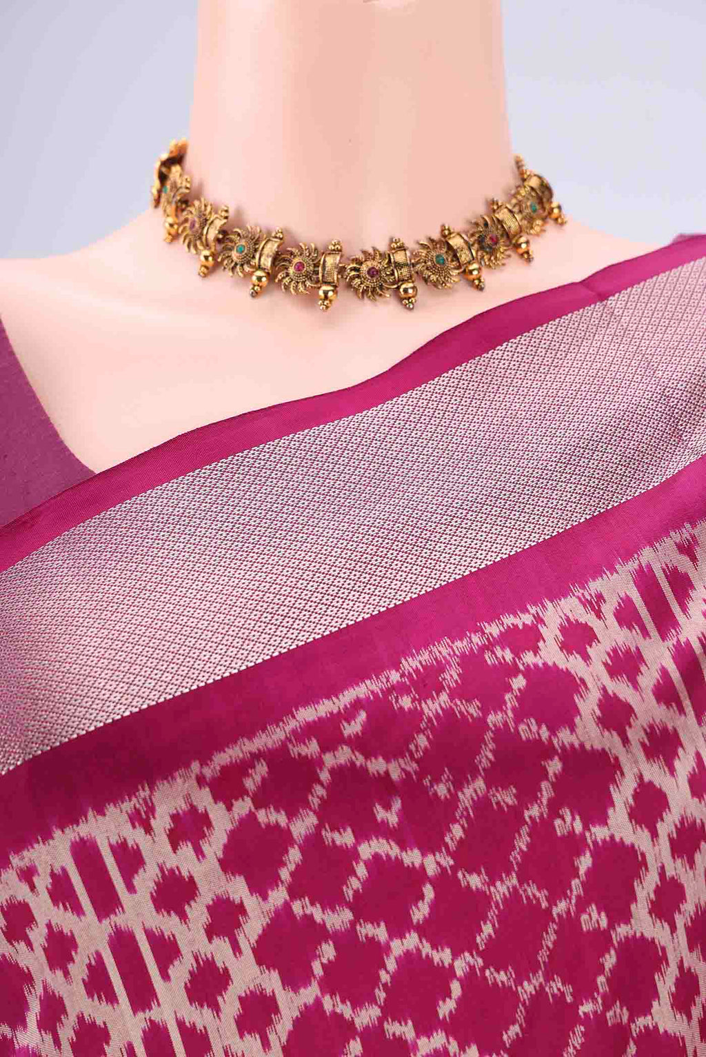 Border image of Magenta Pochampally Silk Saree with Pure Ikat on the body and Zari Border. 