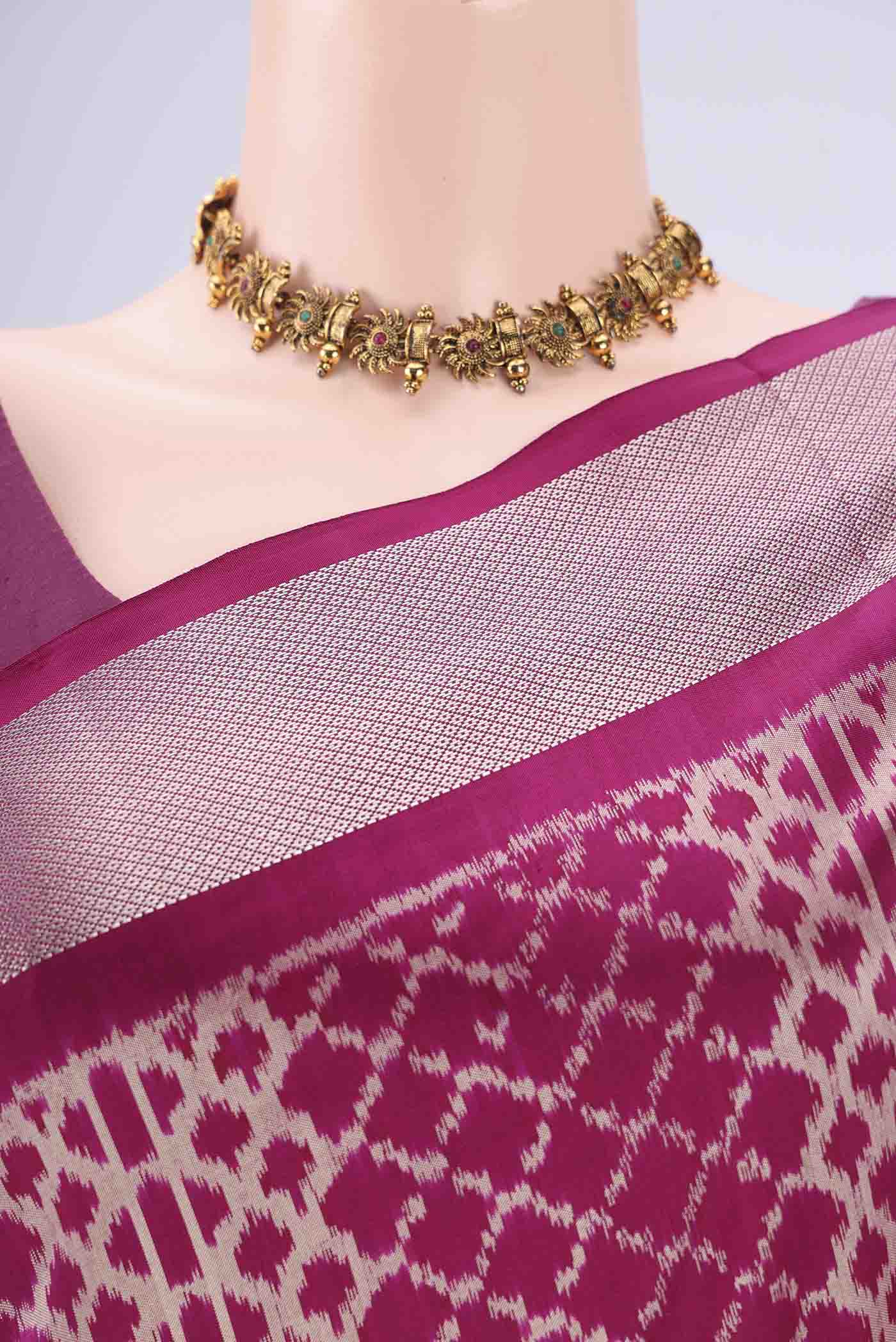 Border image of Magenta Pochampally Silk Saree with Pure Ikat on the body and Zari Border. 