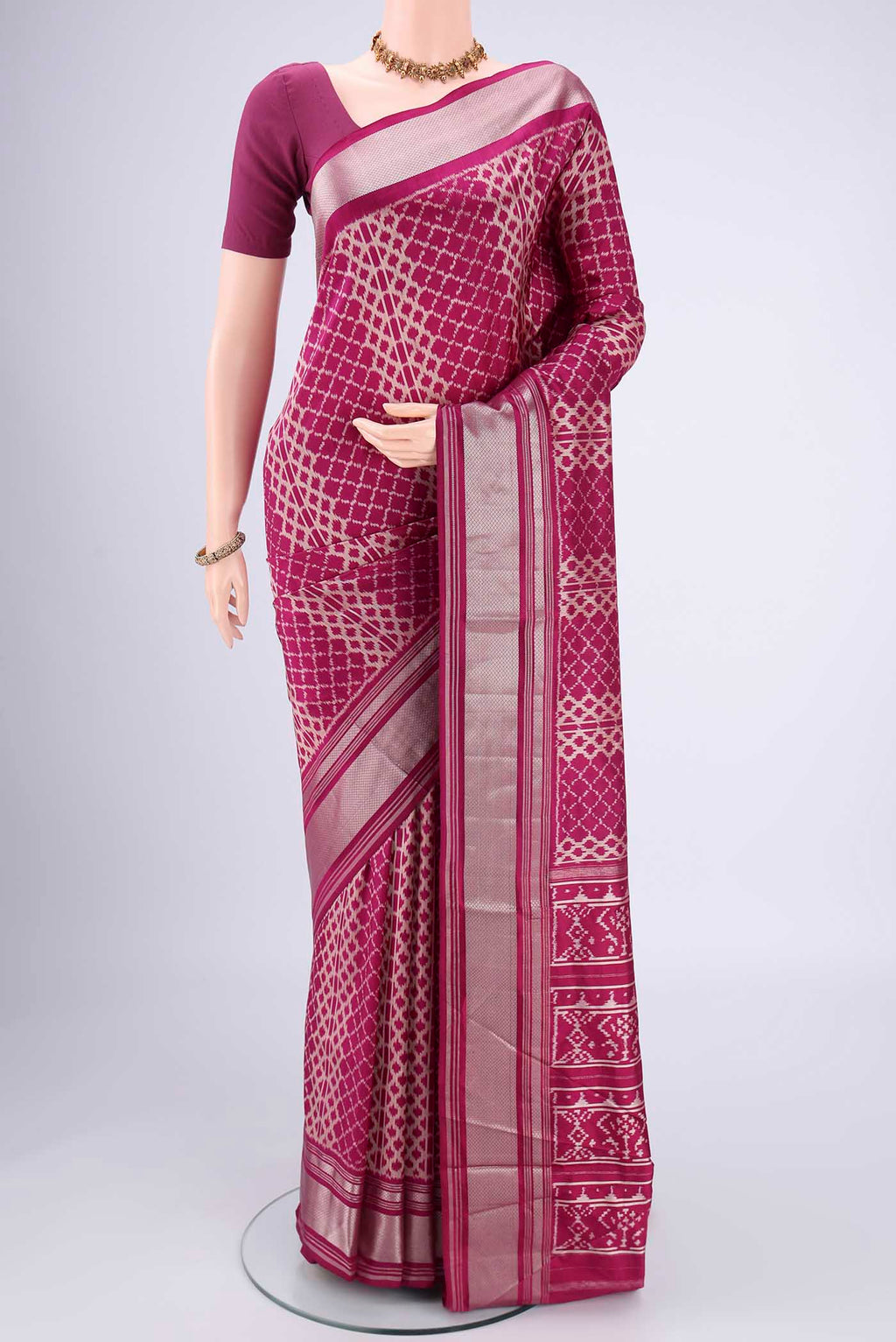 Magenta Pochampally Silk Saree with Pure Ikat on the body and Zari Border.  displayed on a mannequin
