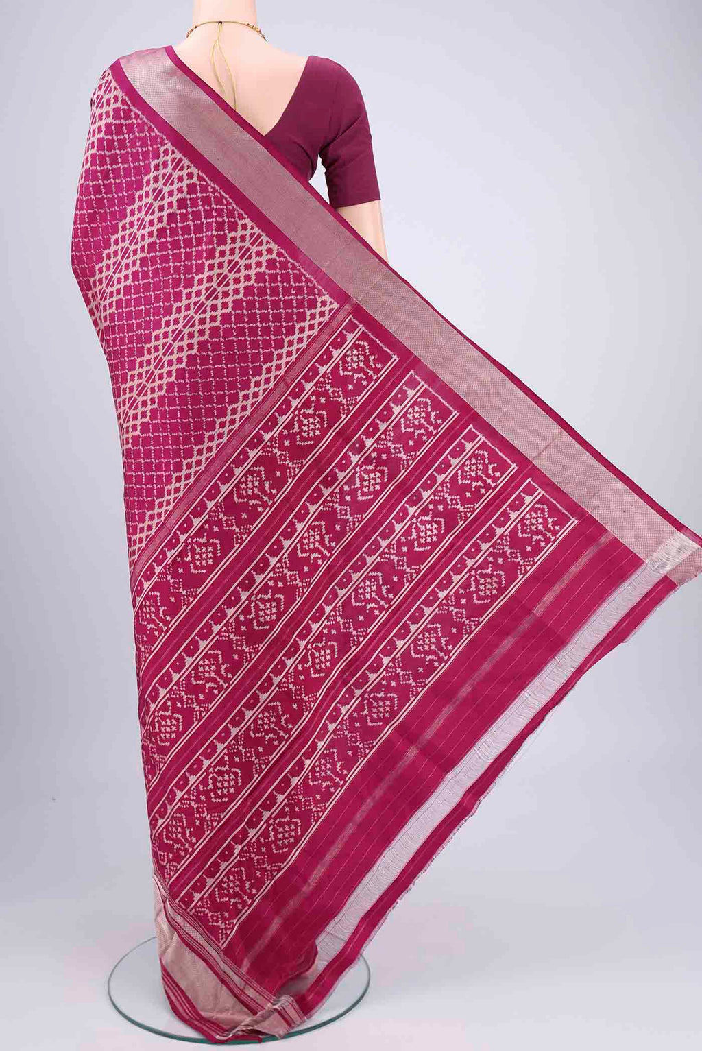Flat view of Magenta Pochampally Silk Saree with Pure Ikat on the body and Zari Border. 
