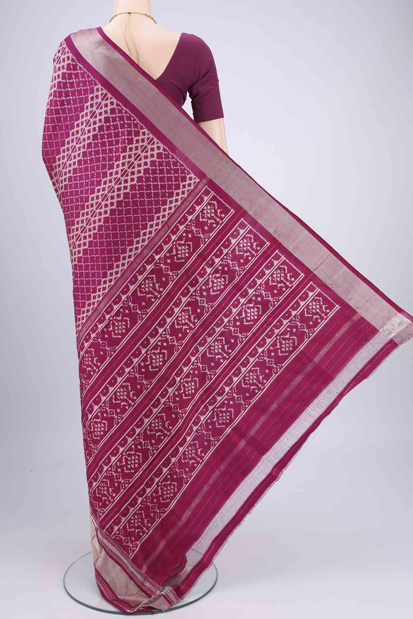 Flat view of Magenta Pochampally Silk Saree with Pure Ikat on the body and Zari Border. 