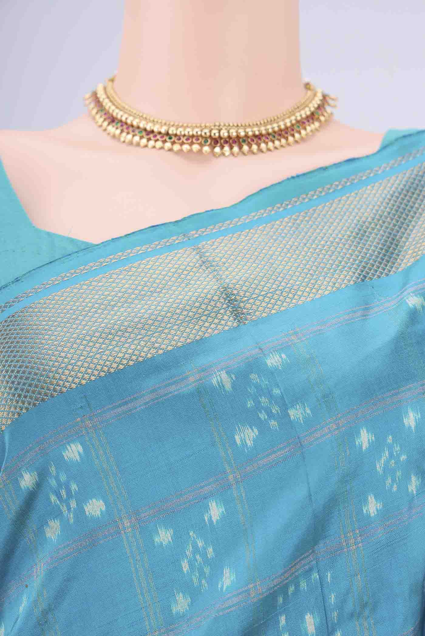 Border image of Turquoise Pochampally Silk Saree with Checked design on the body and Zari Border. 