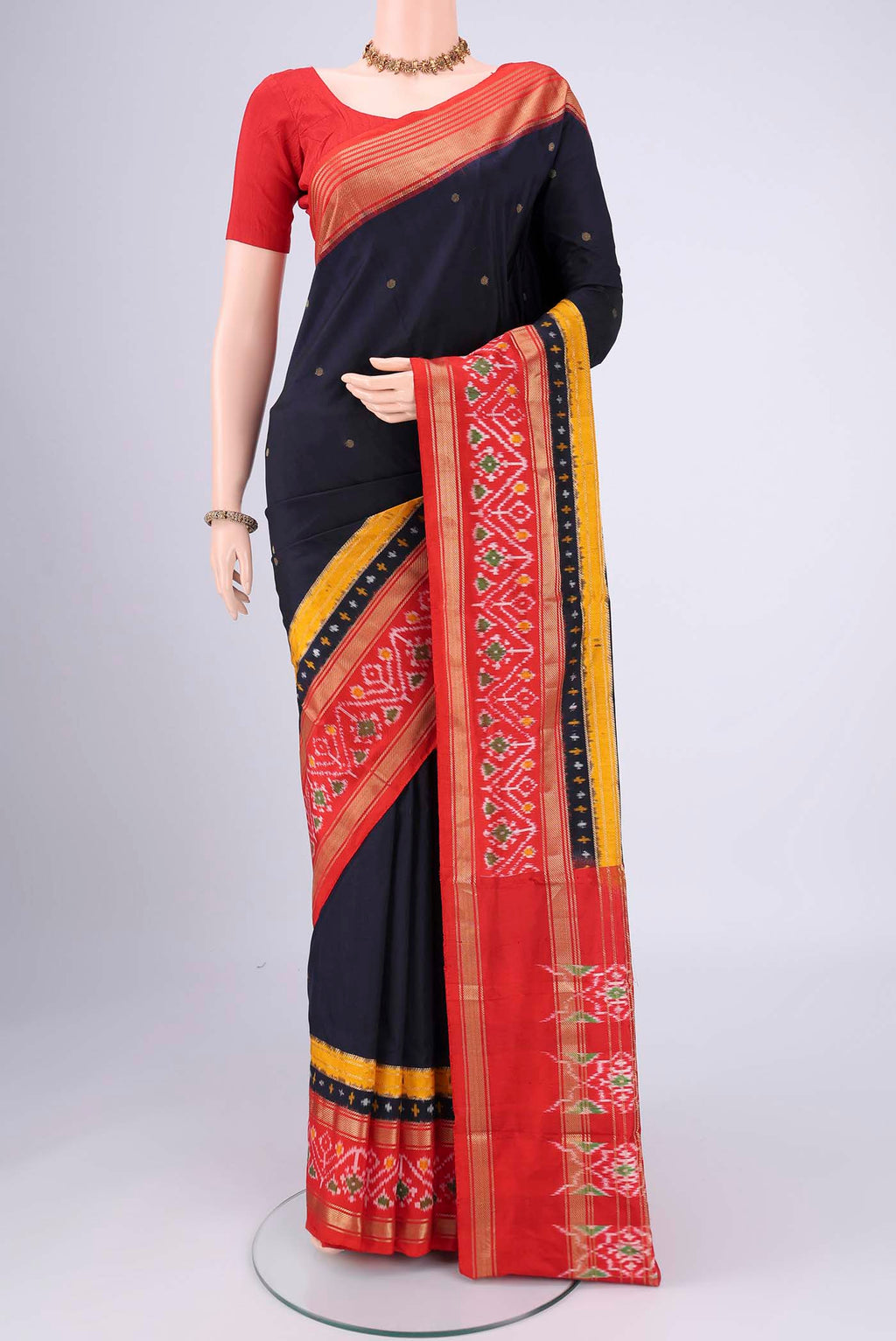 Navy Blue Pochampally Silk Saree with Zari Butta on the body and Zari Border.  displayed on a mannequin