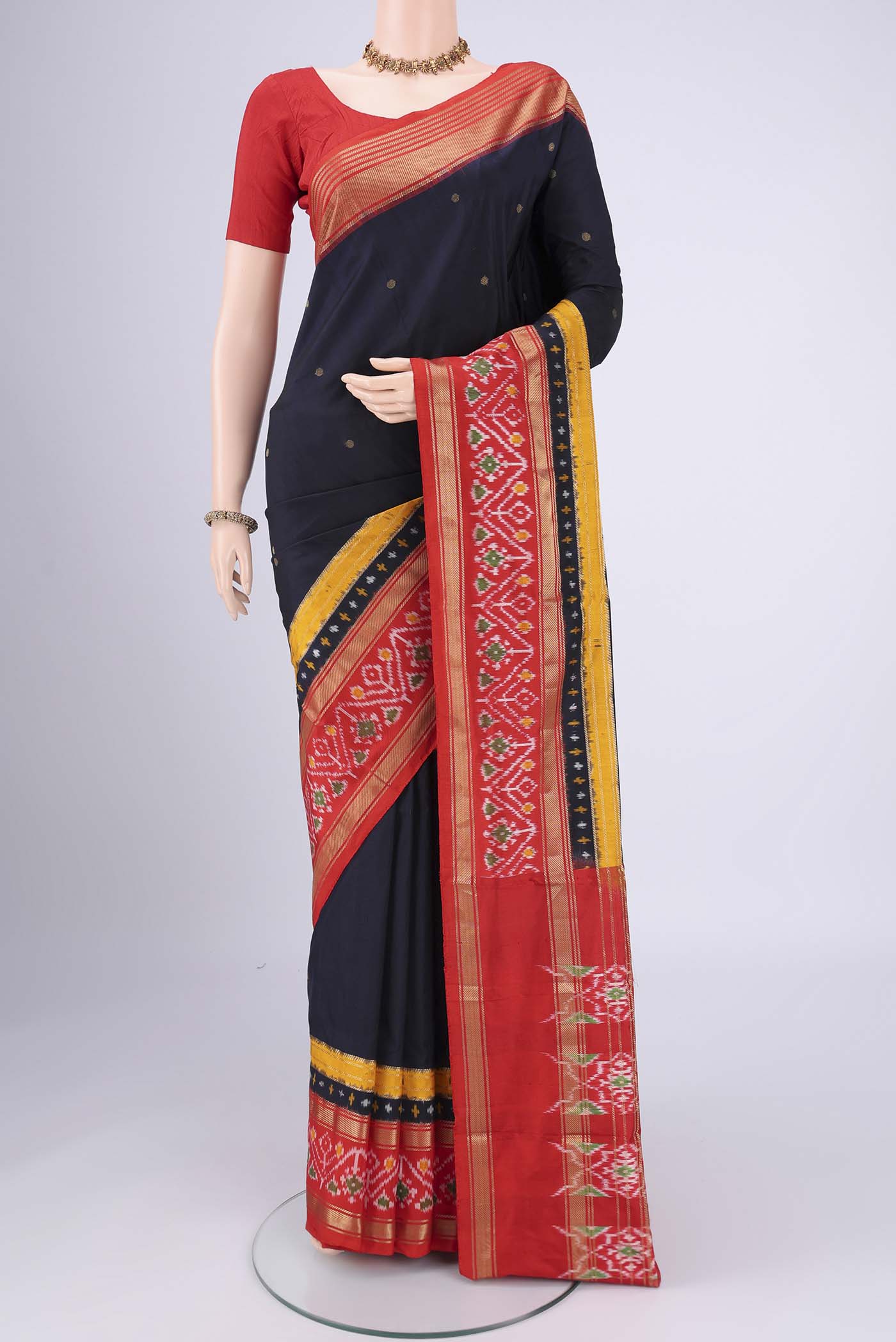 Navy Blue Pochampally Silk Saree with Zari Butta on the body and Zari Border.  displayed on a mannequin