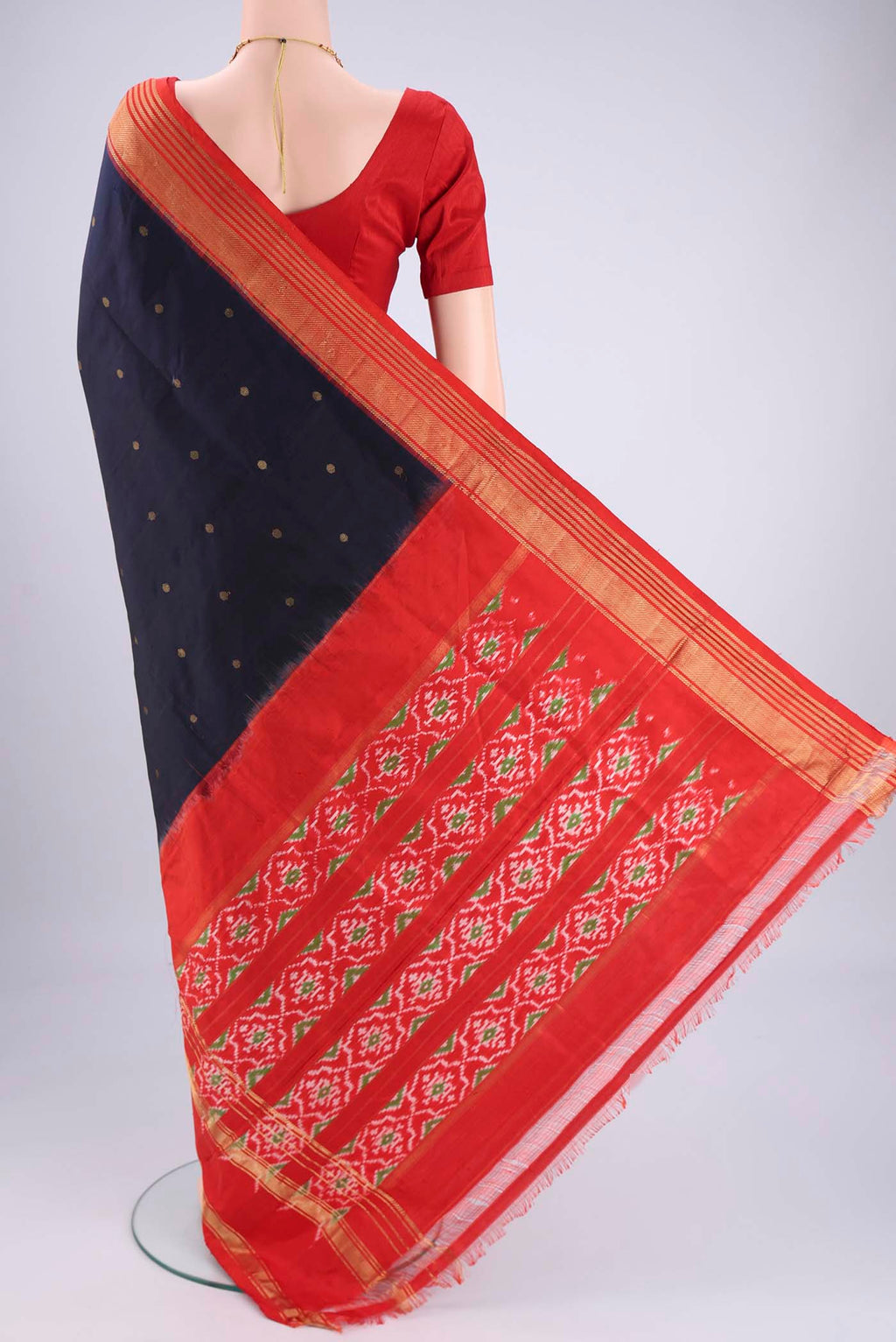 Flat view of Navy Blue Pochampally Silk Saree with Zari Butta on the body and Zari Border. 