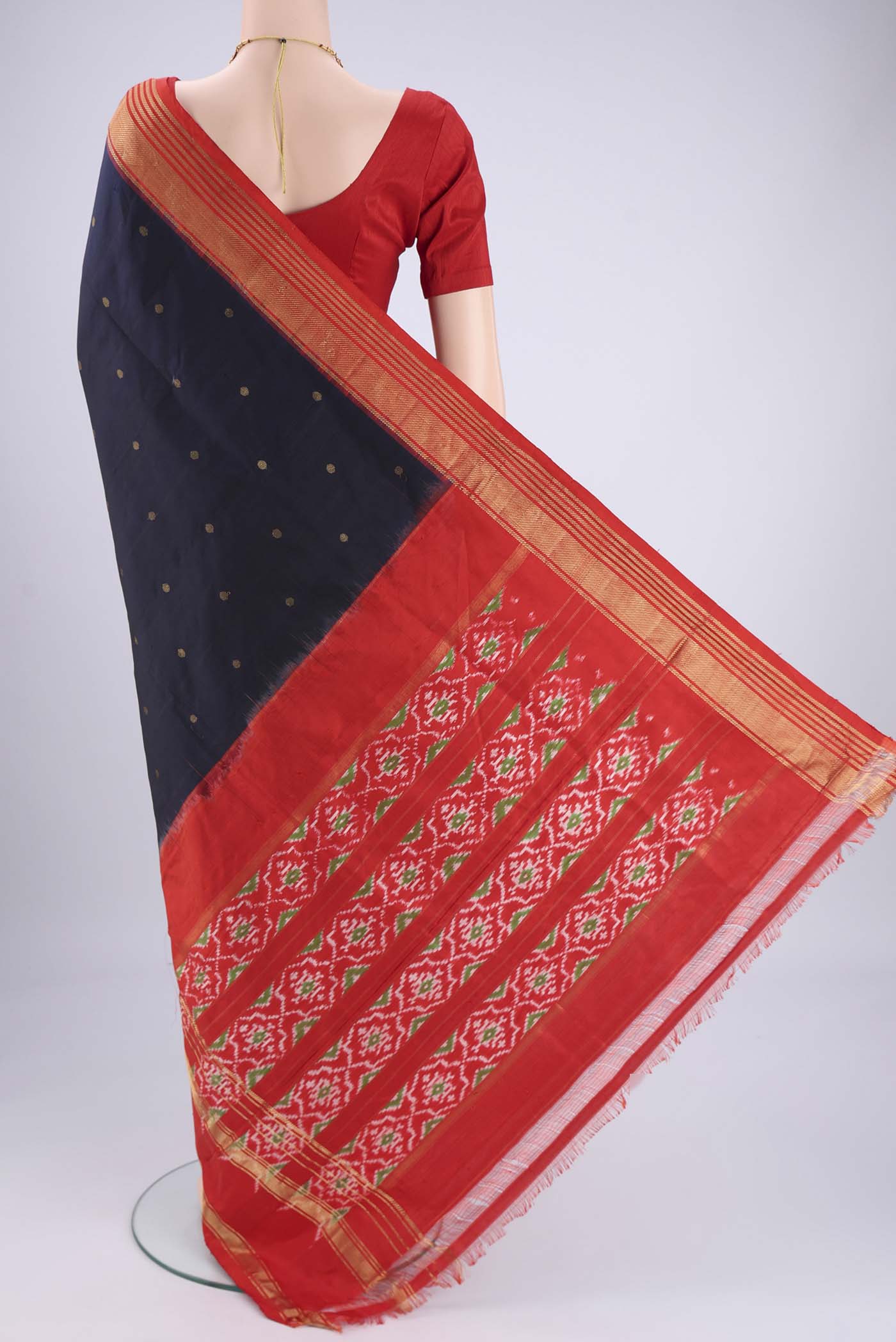 Flat view of Navy Blue Pochampally Silk Saree with Zari Butta on the body and Zari Border. 