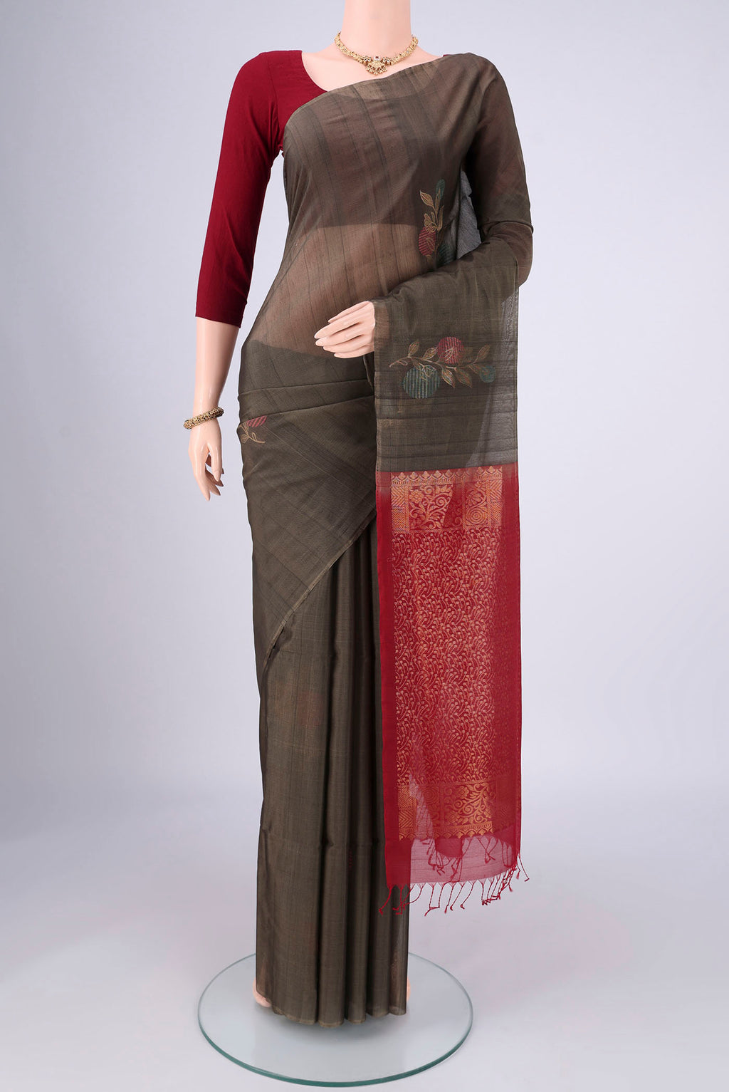 Grey Silk Cotton Saree with Zari Brocade on the body and Zari Border.  displayed on a mannequin