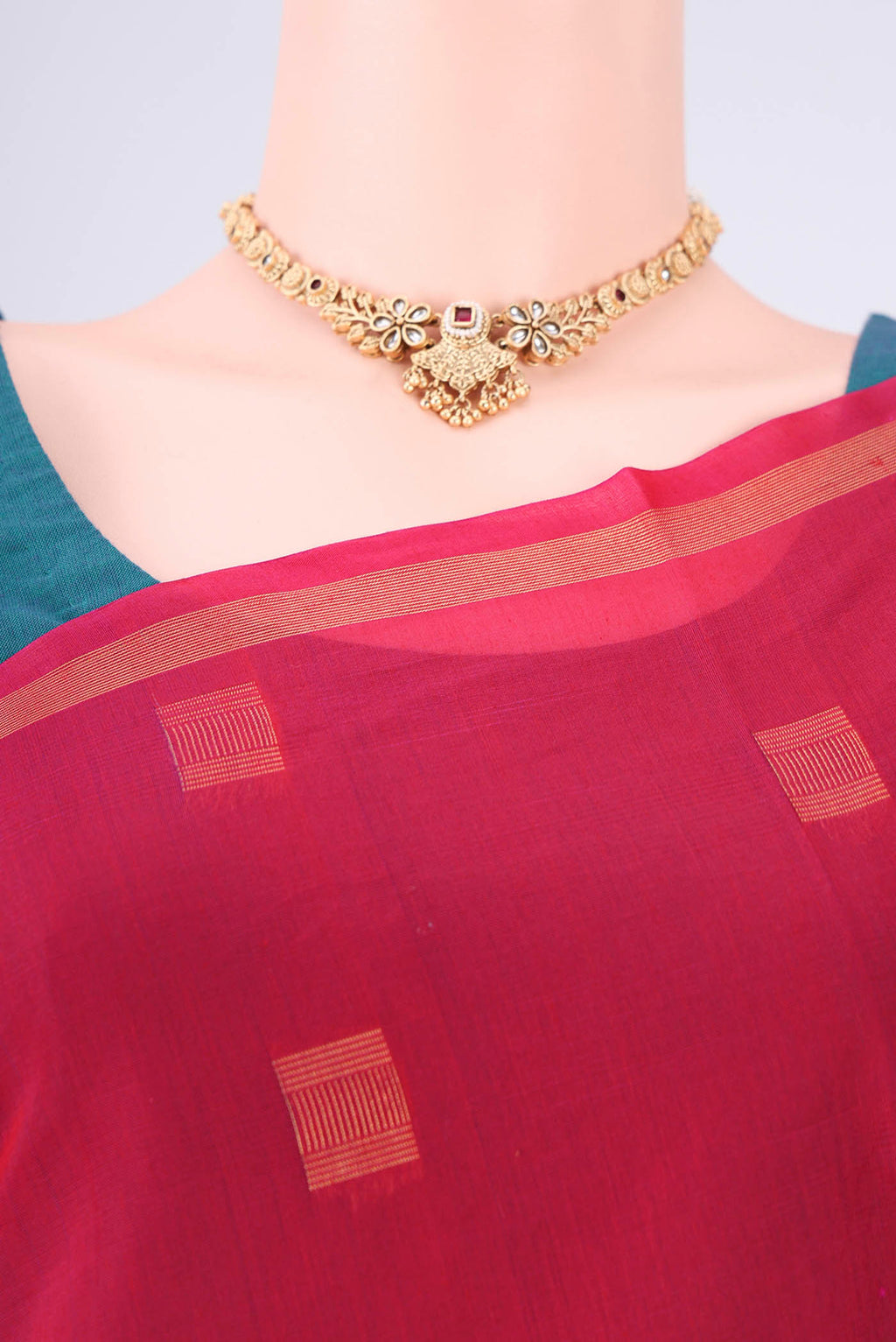 Border image of Red Kora Cotton Saree with Zari Butta on the body and Plain Border. 