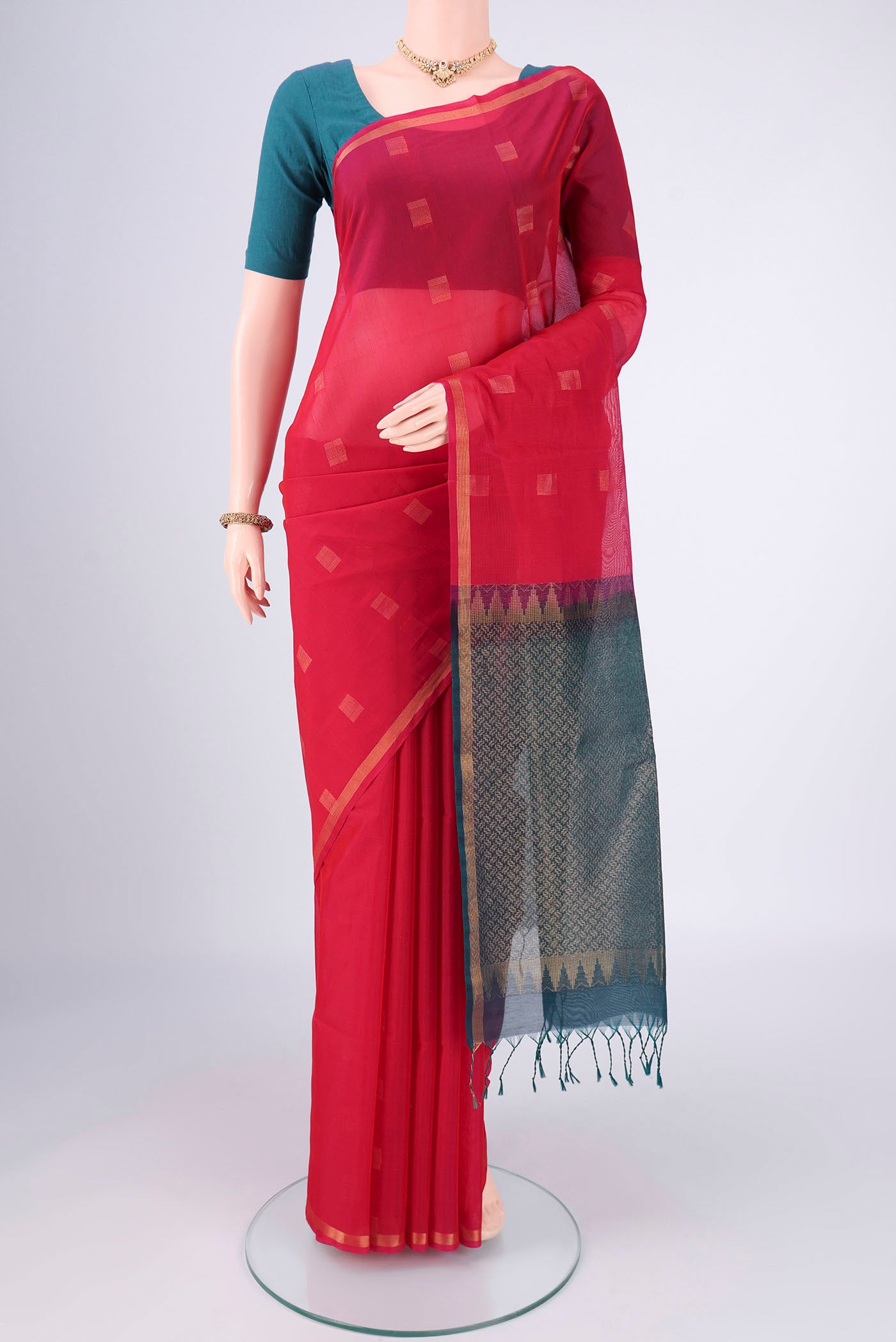 Red Kora Cotton Saree with Zari Butta on the body and Plain Border.  displayed on a mannequin