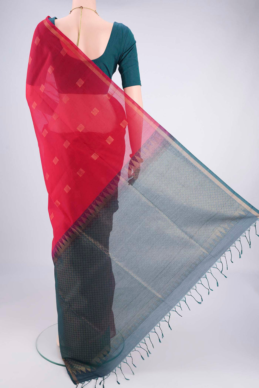 Flat view of Red Kora Cotton Saree with Zari Butta on the body and Plain Border. 