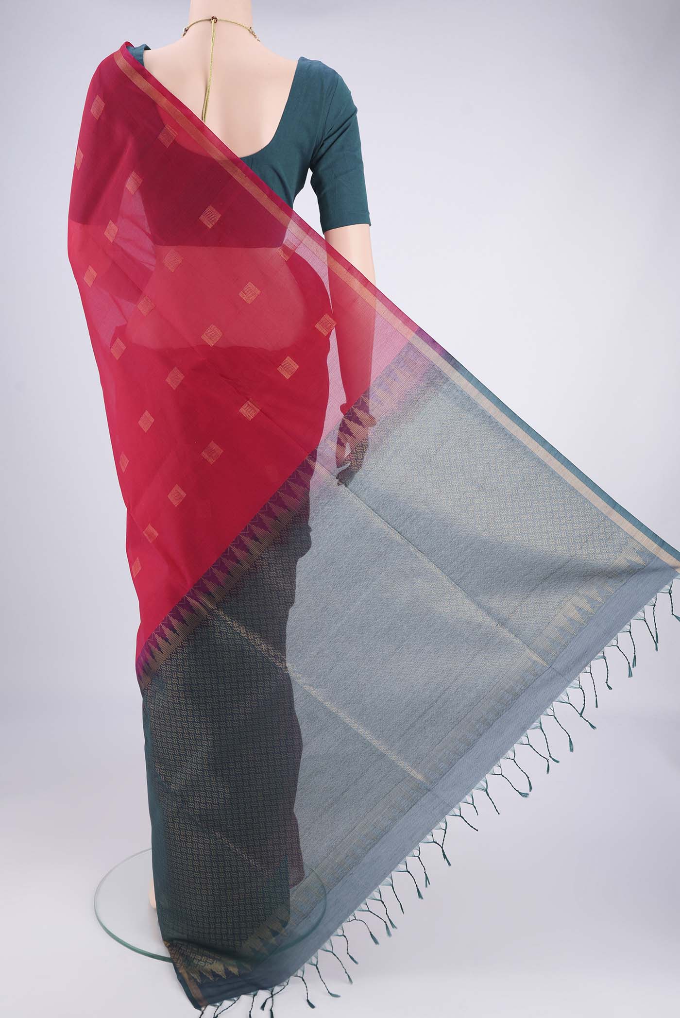 Flat view of Red Kora Cotton Saree with Zari Butta on the body and Plain Border. 