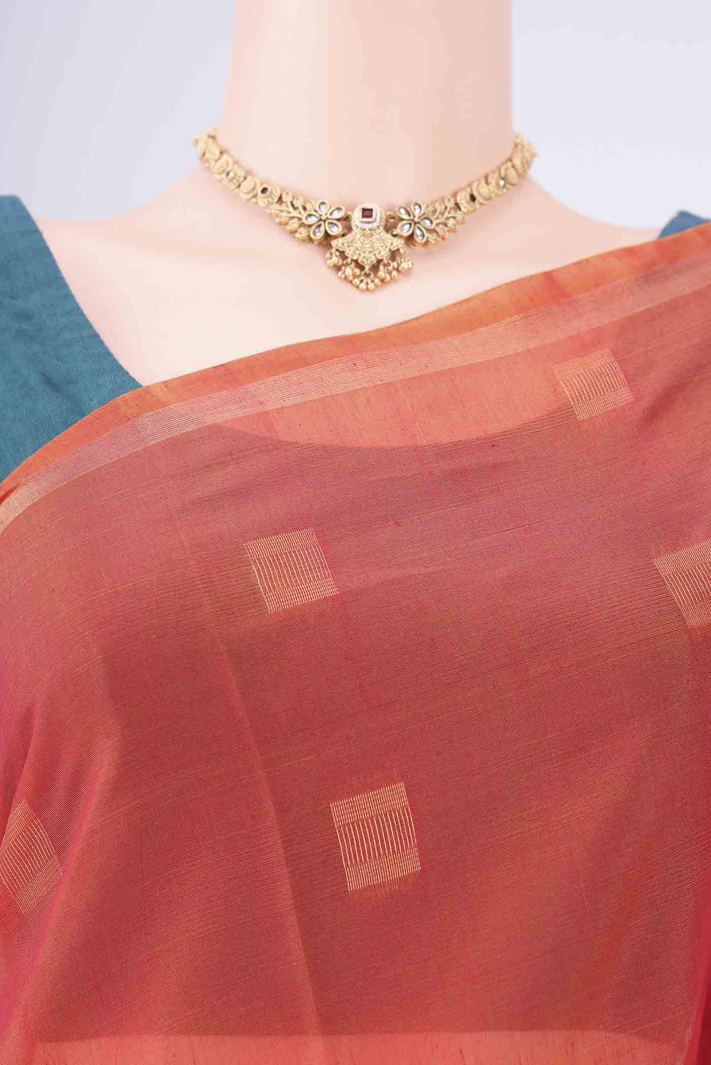 Border image of Orange Kora Cotton Saree with Zari Butta on the body and Plain Border. 