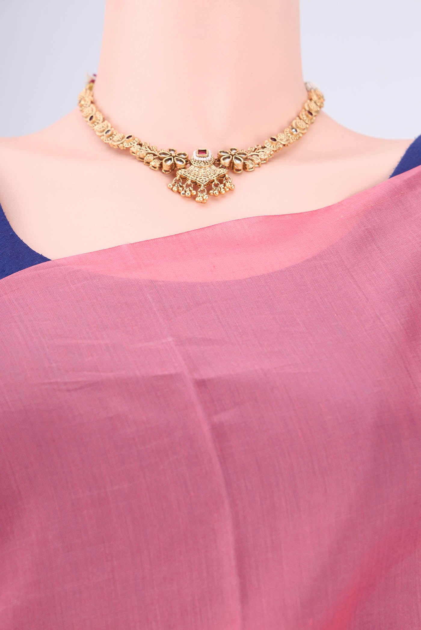 Border image of Pink Kora Cotton Saree with Zari Butta on the body and Plain Border. 