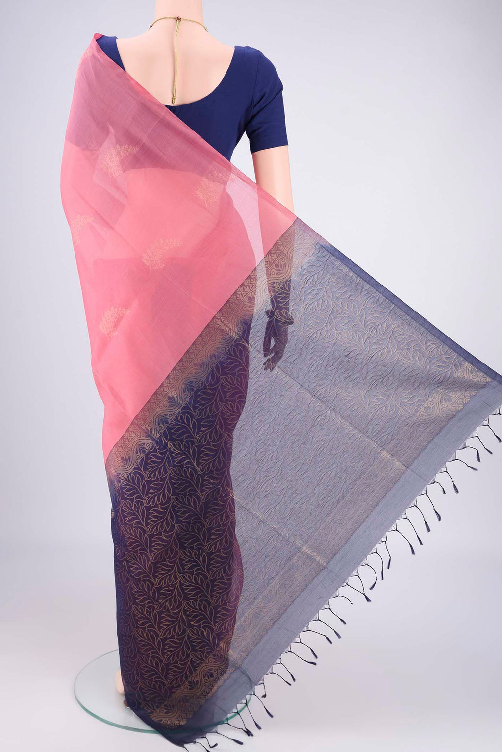 Flat view of Pink Kora Cotton Saree with Zari Butta on the body and Plain Border. 
