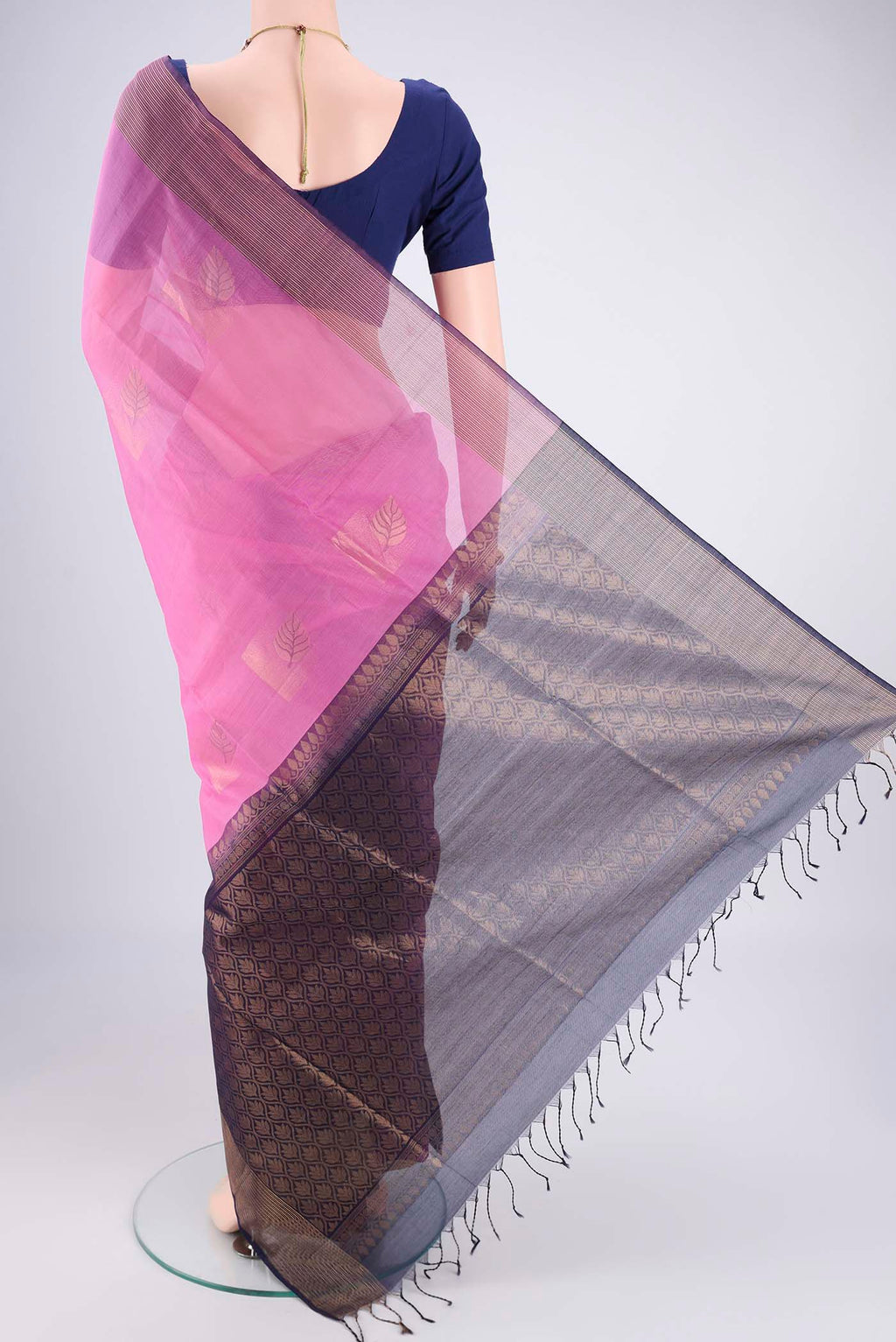 Flat view of Pink Kora Cotton Saree with Zari Butta on the body and Plain Border. 