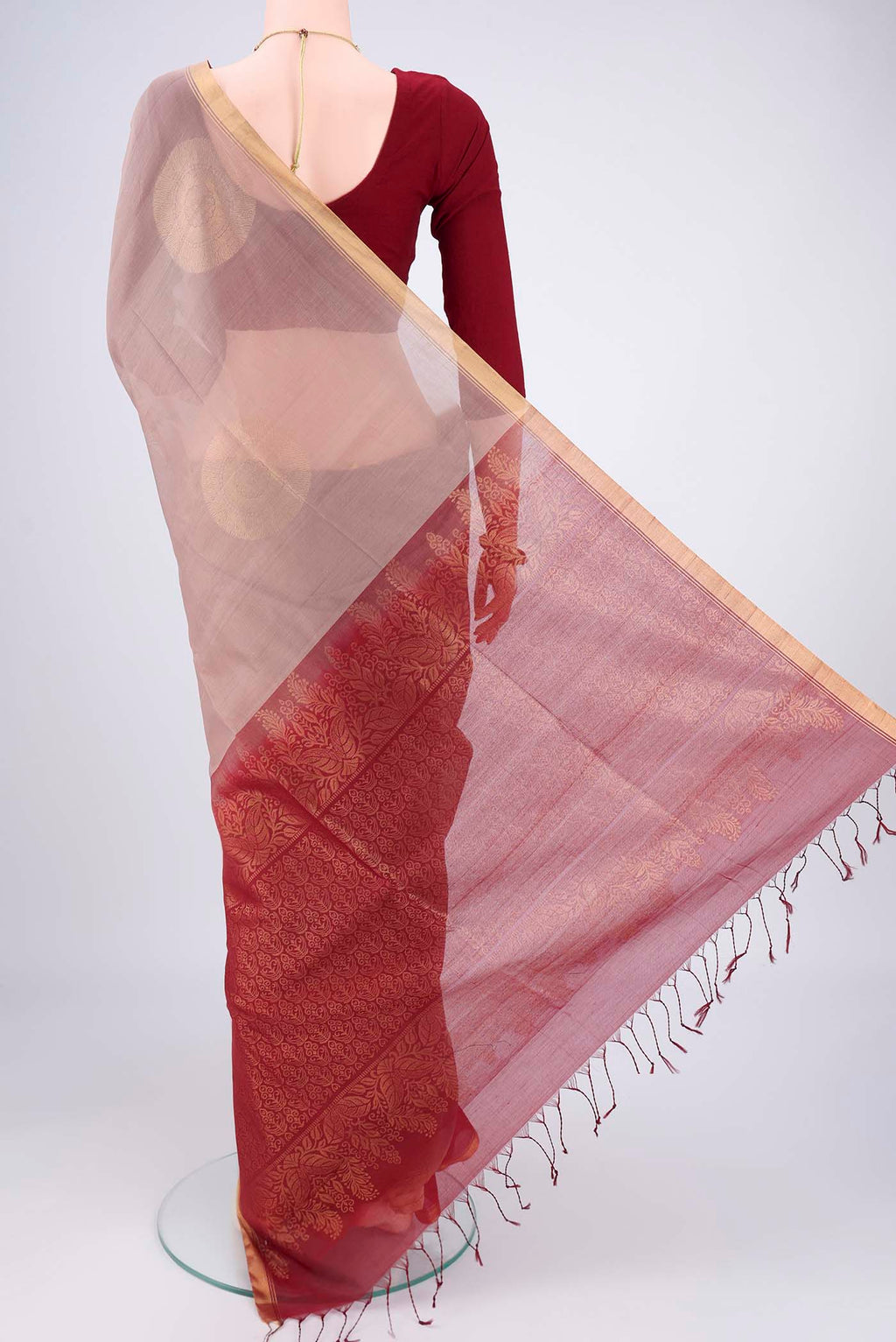 Flat view of Dark Beige Kora Cotton Saree with Zari Butta on the body and Plain Border. 