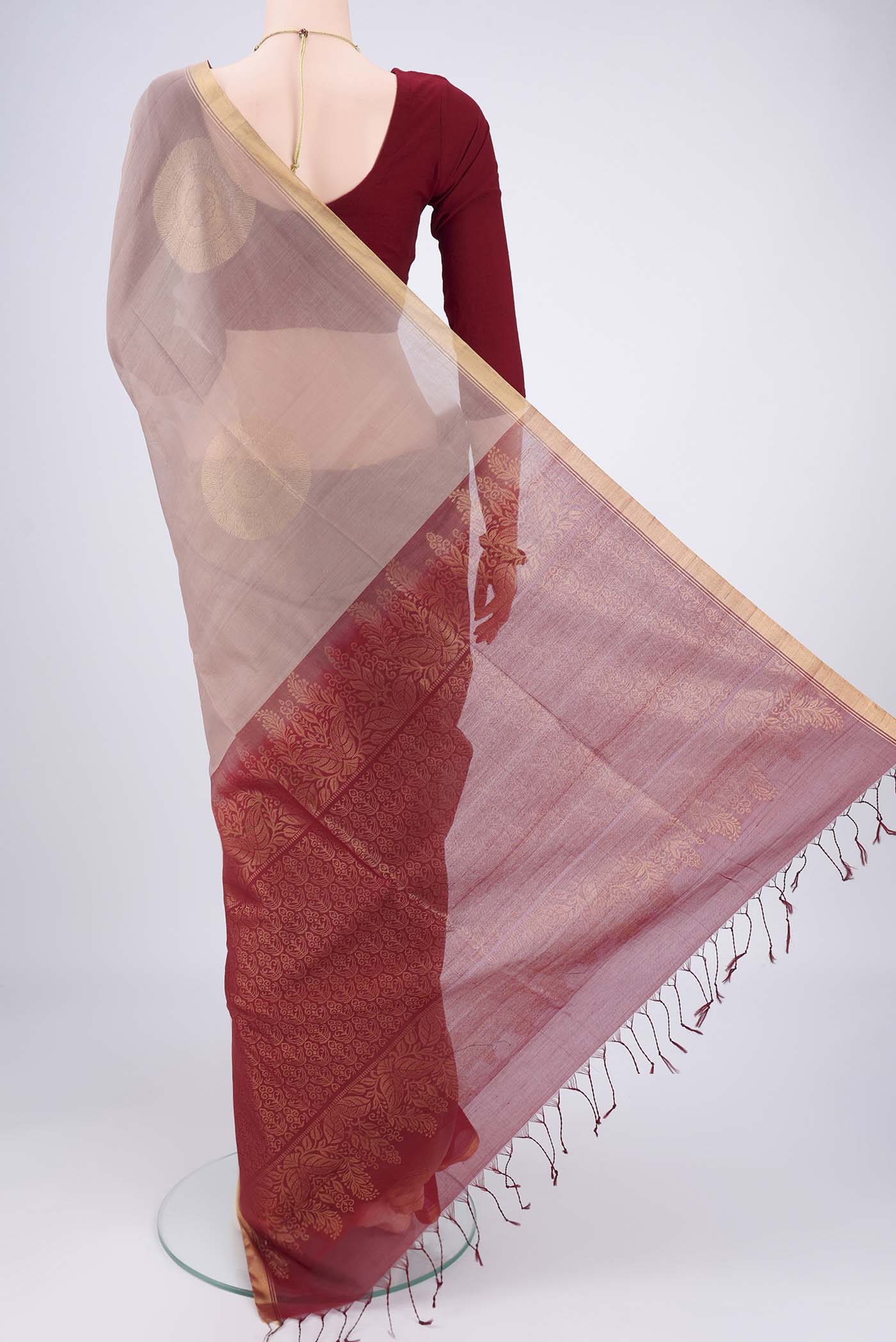 Flat view of Dark Beige Kora Cotton Saree with Zari Butta on the body and Plain Border. 