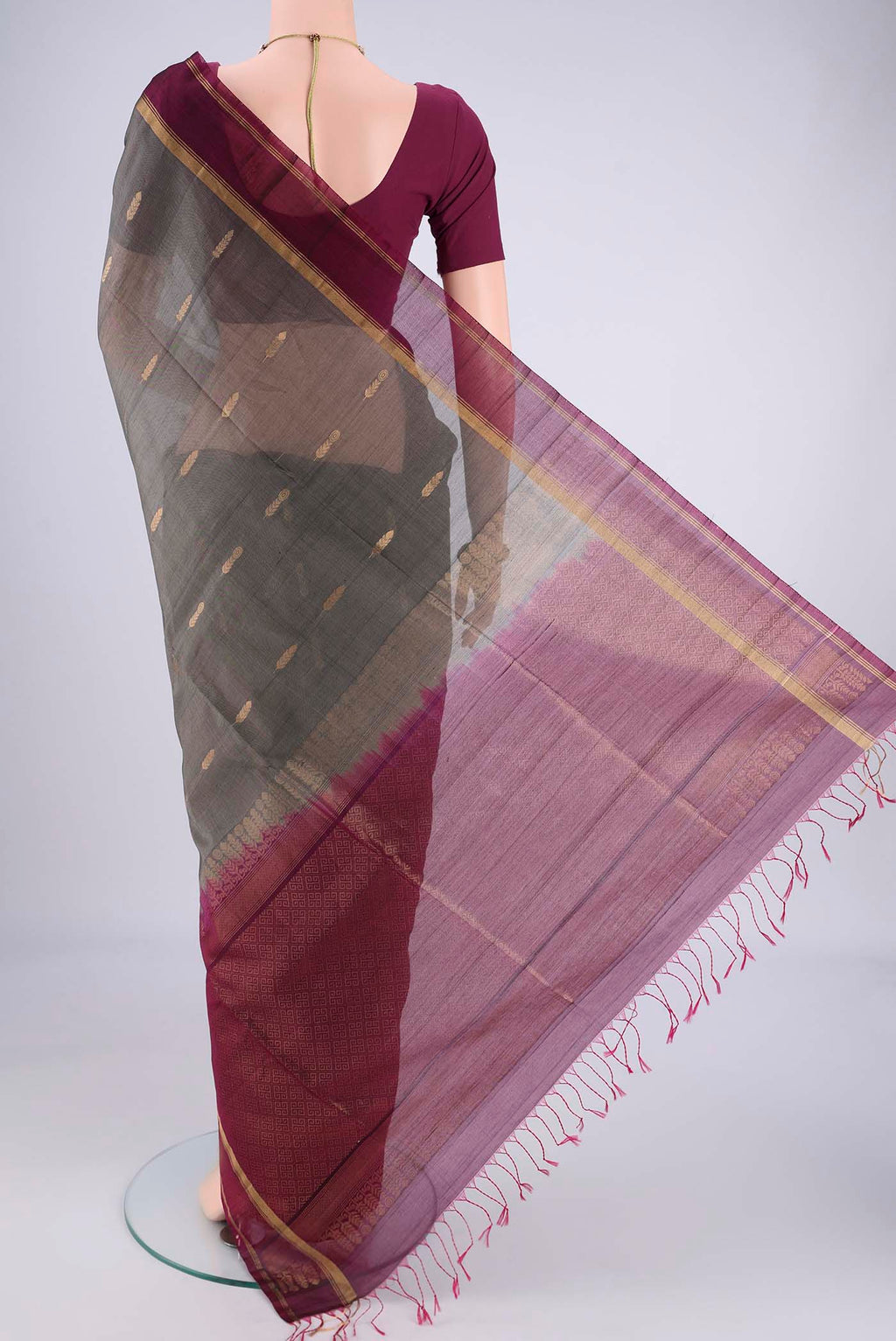 Flat view of Grey Silk Cotton Saree with Zari Brocade on the body and Zari Border. 