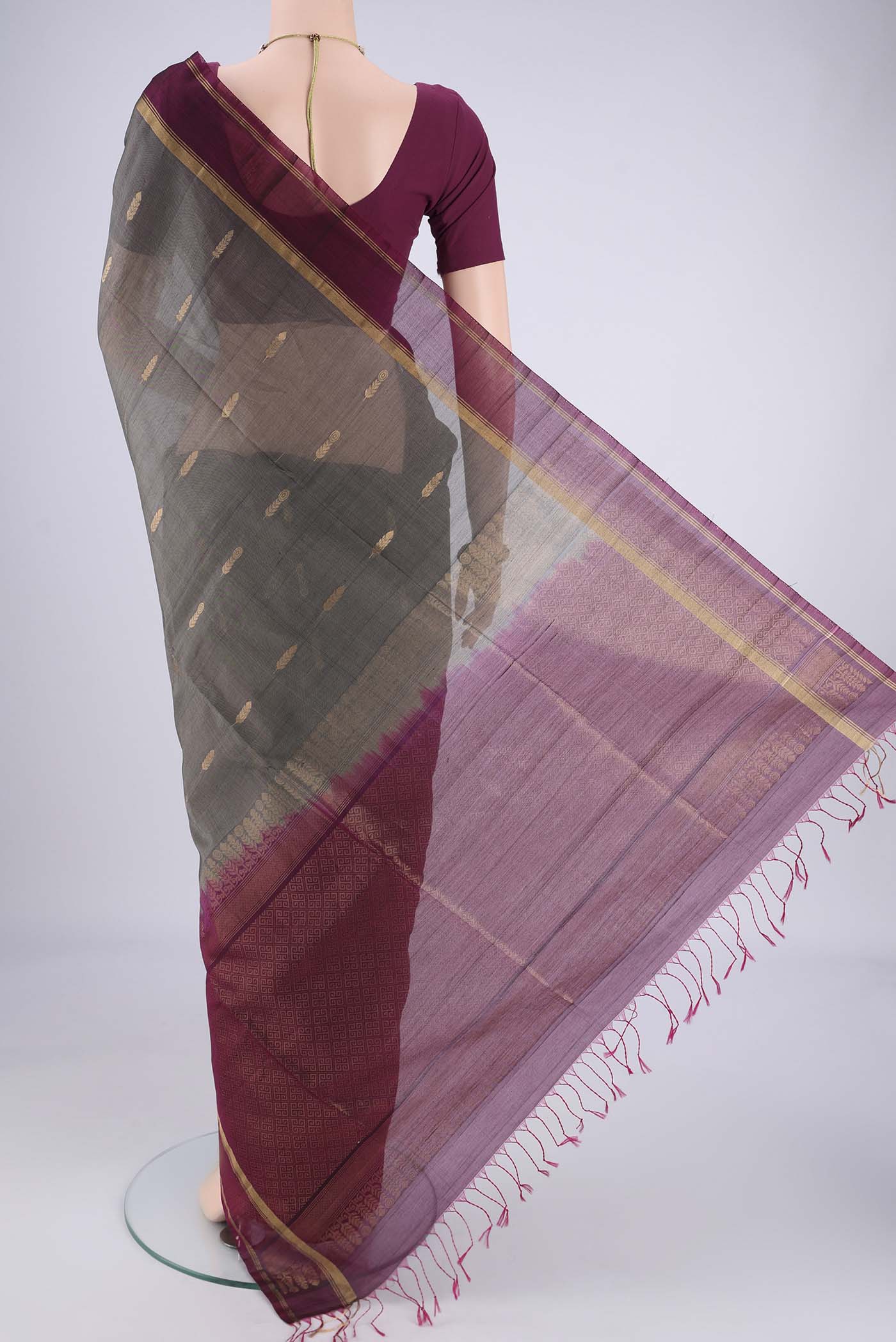 Flat view of Grey Silk Cotton Saree with Zari Brocade on the body and Zari Border. 
