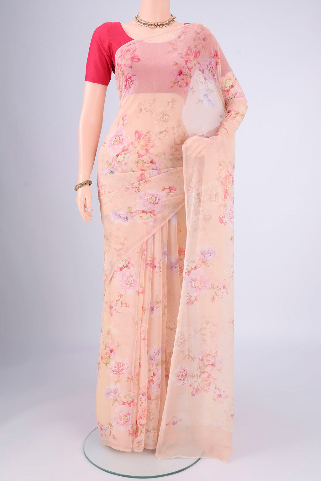 Peach Mysore Chiffon Saree with Floral Print on the body and Without Border.  displayed on a mannequin