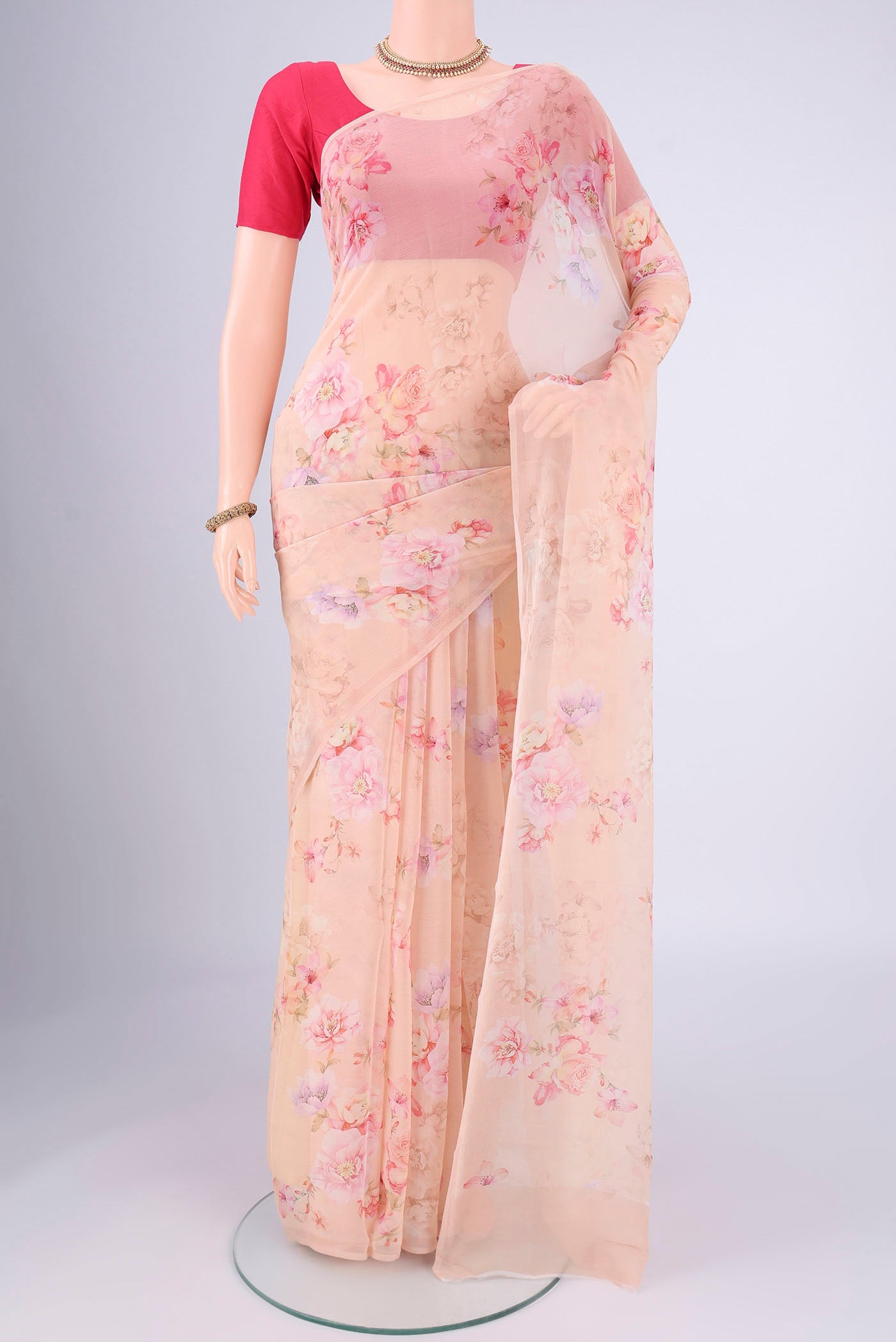 Peach Mysore Chiffon Saree with Floral Print on the body and Without Border.  displayed on a mannequin