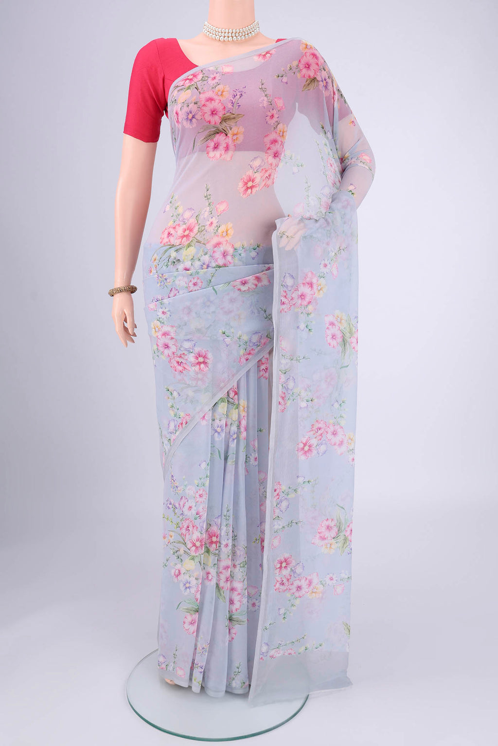 Sky Blue Mysore Chiffon Saree with Floral Print on the body and Without Border.  displayed on a mannequin