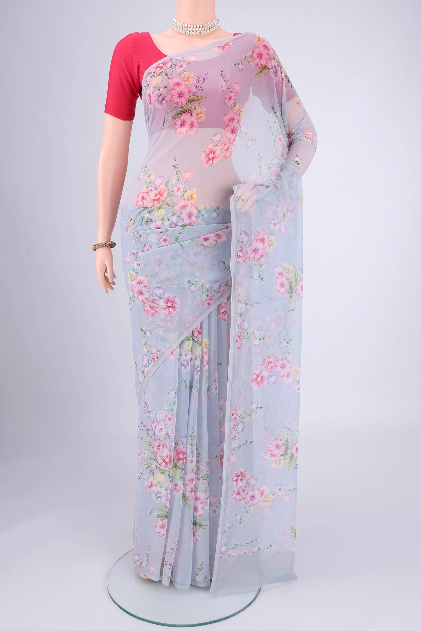Sky Blue Mysore Chiffon Saree with Floral Print on the body and Without Border.  displayed on a mannequin
