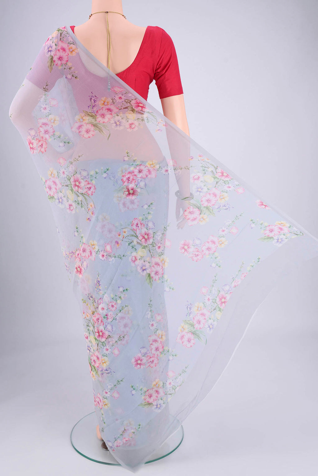 Flat view of Sky Blue Mysore Chiffon Saree with Floral Print on the body and Without Border. 