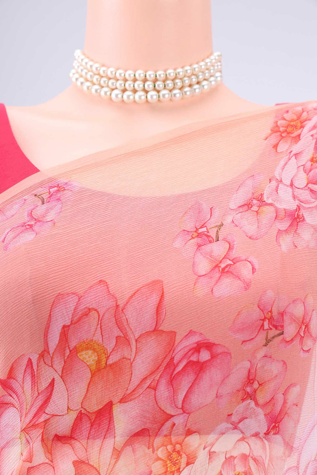 Border image of Peach Mysore Chiffon Saree with Floral Print on the body and Plain Border. 