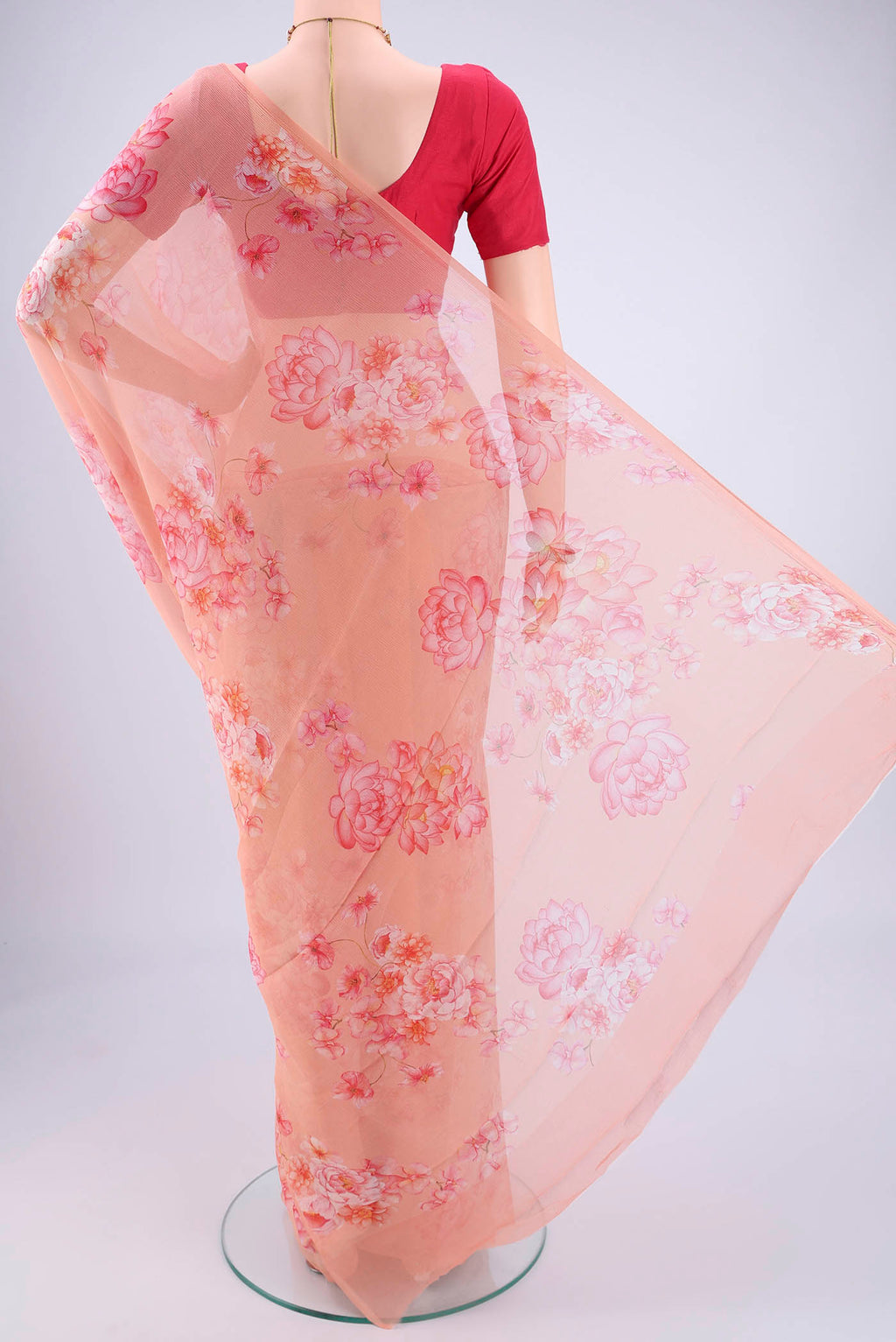 Flat view of Peach Mysore Chiffon Saree with Floral Print on the body and Plain Border. 