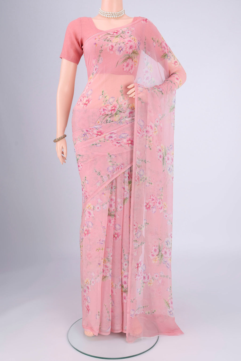 Rose pink Mysore Chiffon Saree with Floral Print on the body and Printed Border.  displayed on a mannequin