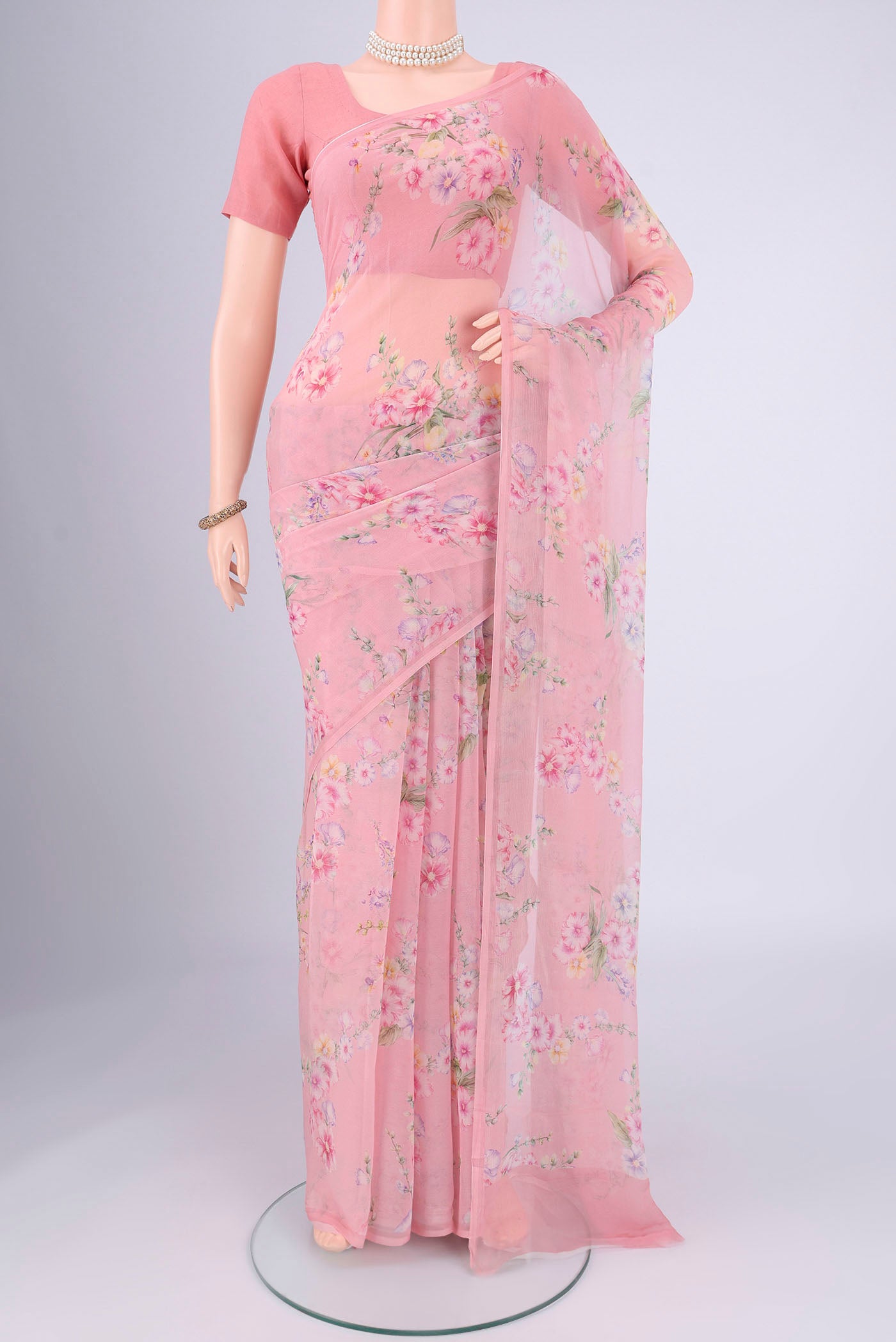 Rose pink Mysore Chiffon Saree with Floral Print on the body and Printed Border.  displayed on a mannequin