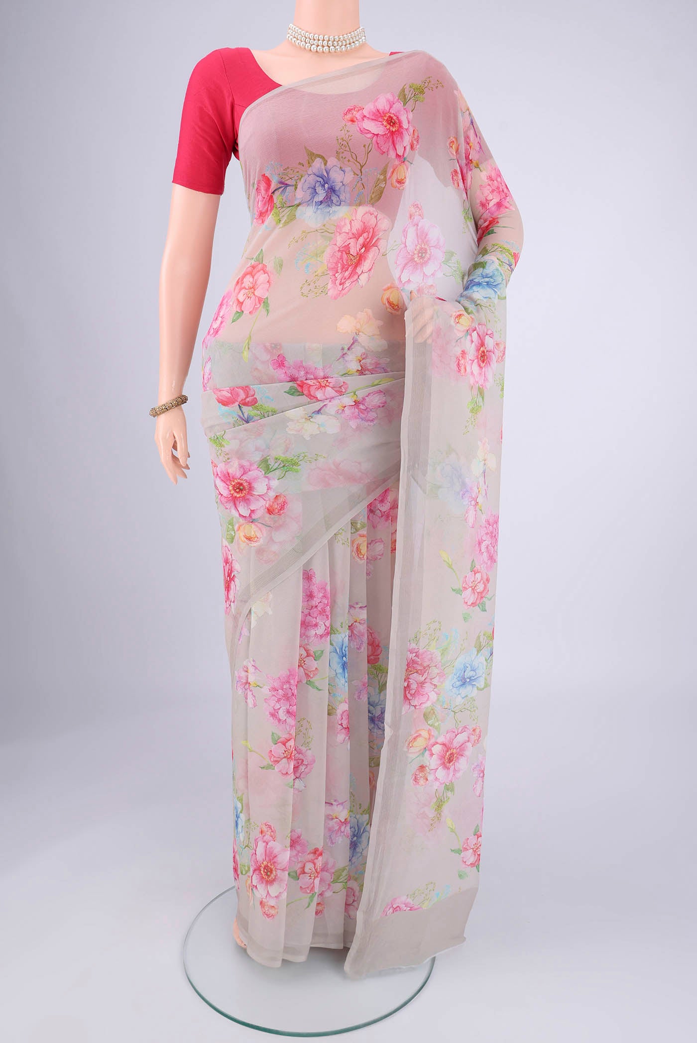 Grey Mysore Chiffon Saree with Floral Print on the body and Without Border.  displayed on a mannequin