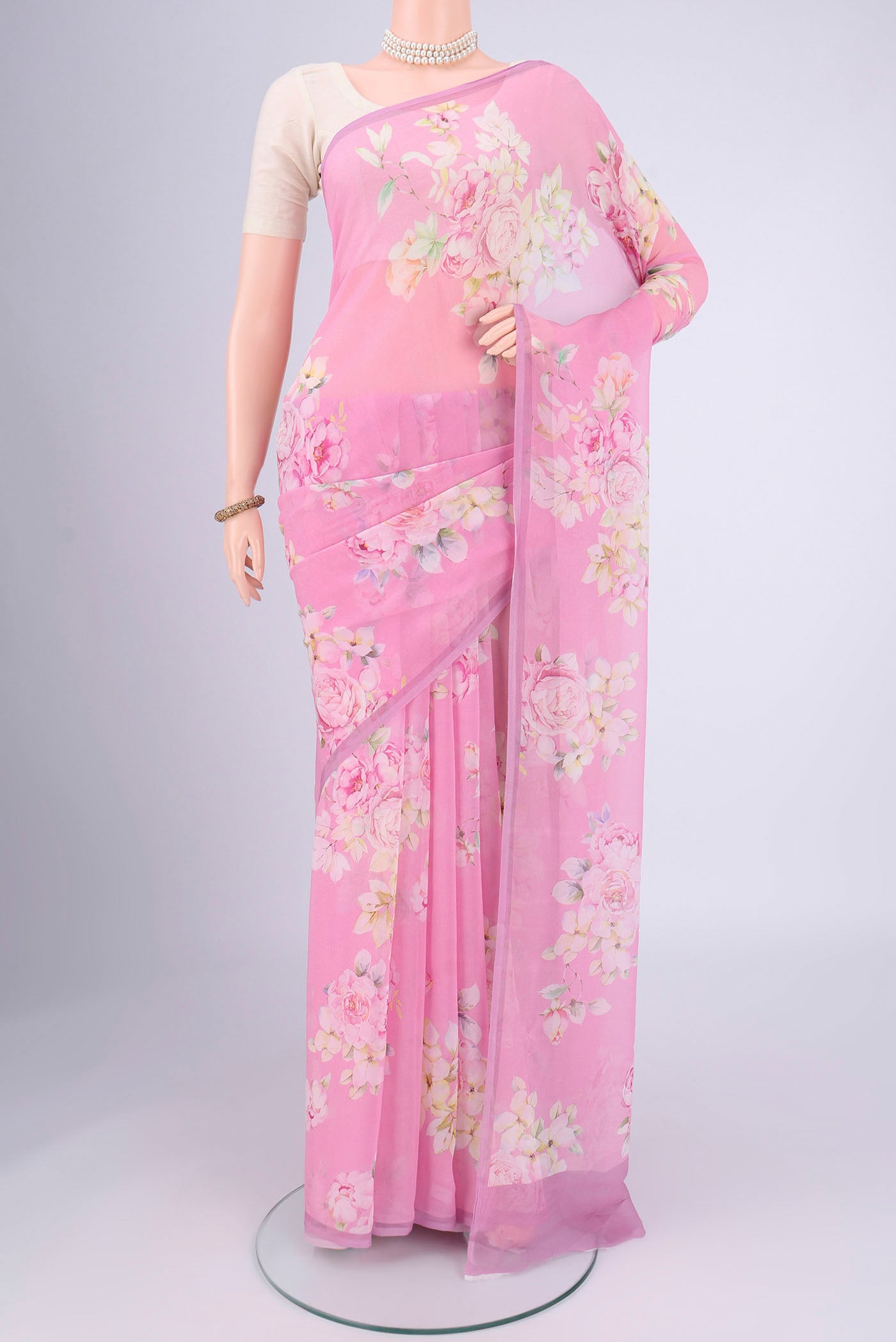 Rose pink Mysore Chiffon Saree with Floral Print on the body and Without Border.  displayed on a mannequin