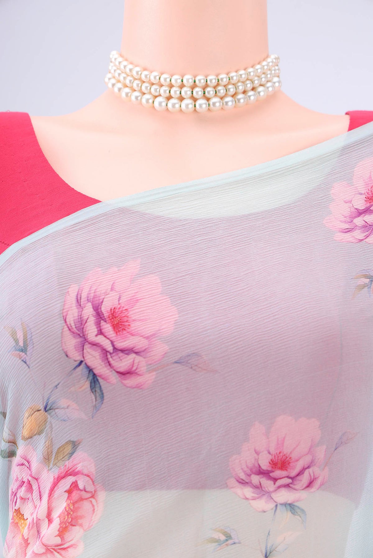 Border image of Sky Blue Mysore Chiffon Saree with Floral Print on the body and Plain Border. 