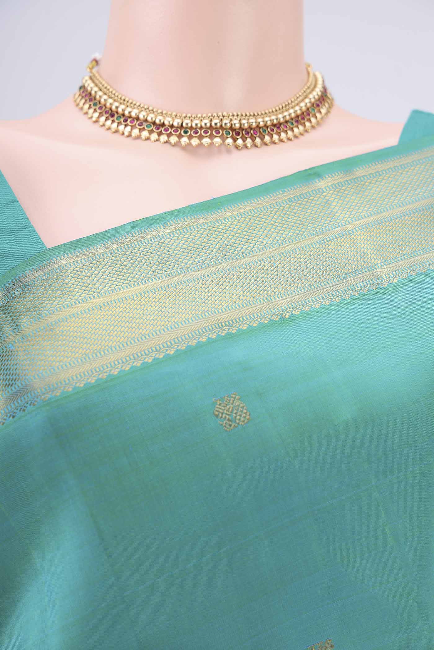 Border image of Pure Silk Pure Zari Sea Green Dual Tone Kanjivaram Saree with Zari Butta on the body and Zari Border. 