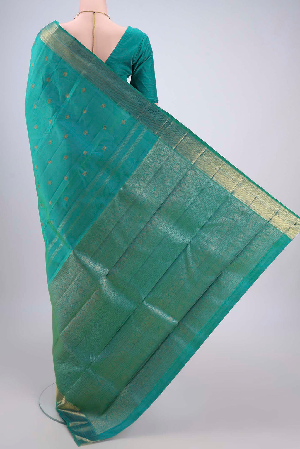 Flat view of Pure Silk Pure Zari Sea Green Dual Tone Kanjivaram Saree with Zari Butta on the body and Zari Border. 