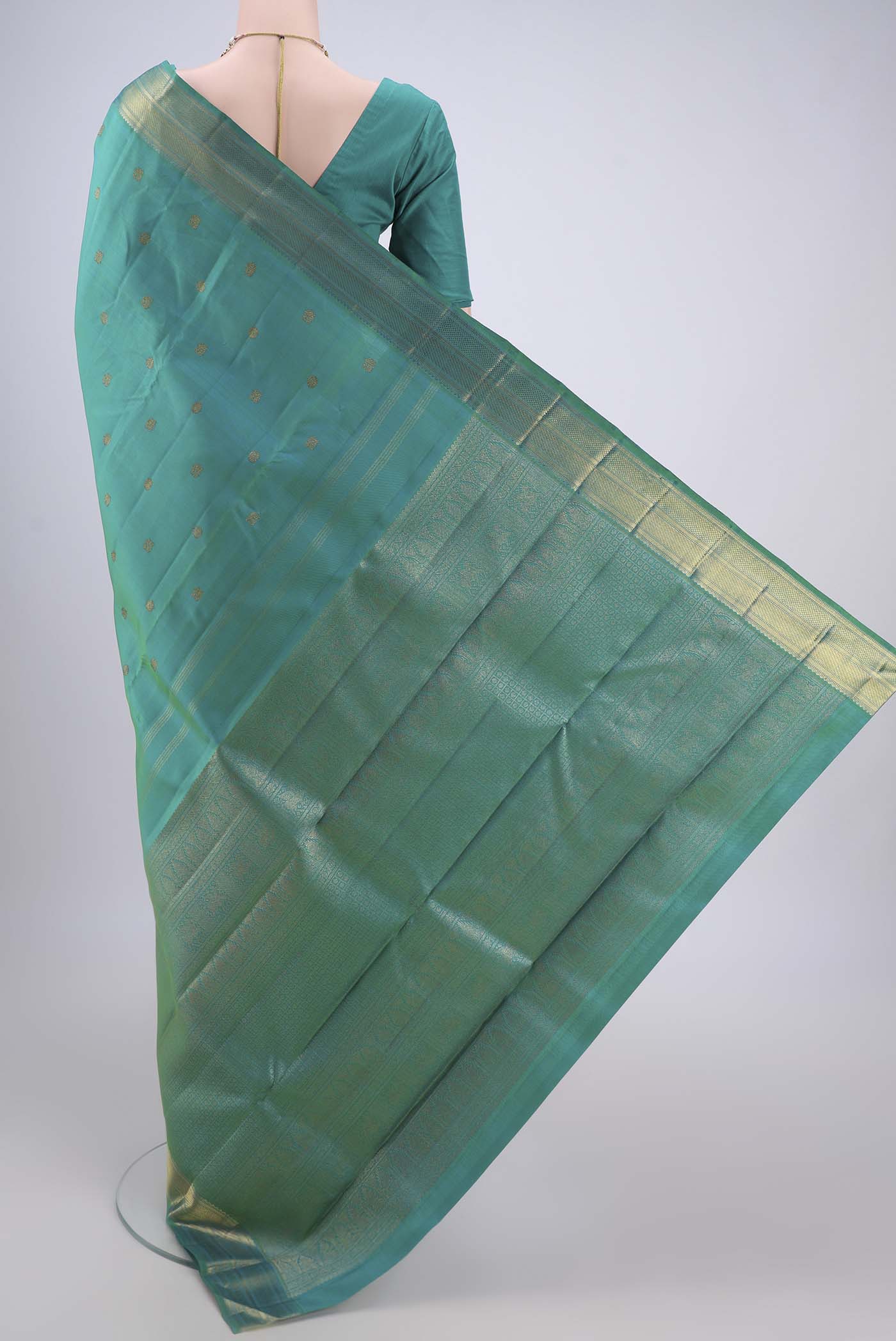 Flat view of Pure Silk Pure Zari Sea Green Dual Tone Kanjivaram Saree with Zari Butta on the body and Zari Border. 