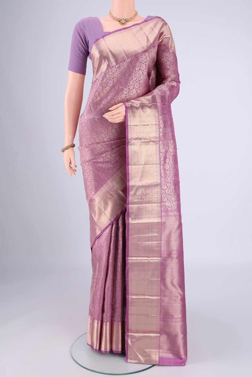 Lilac Dual Tone Kanchipuram Silk Saree with Zari Brocade on the body and Zari Border.  displayed on a mannequin