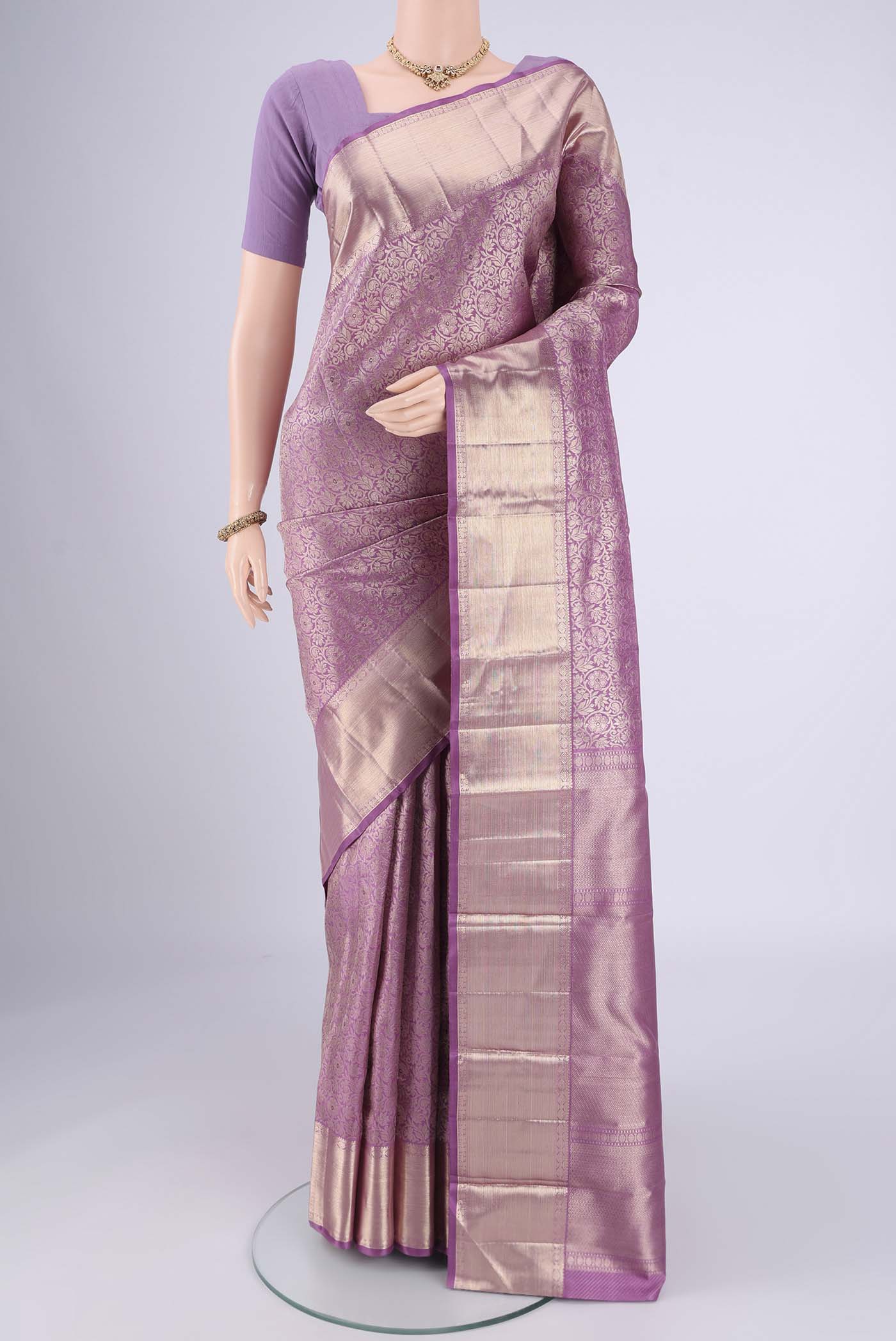 Lilac Dual Tone Kanchipuram Silk Saree with Zari Brocade on the body and Zari Border.  displayed on a mannequin